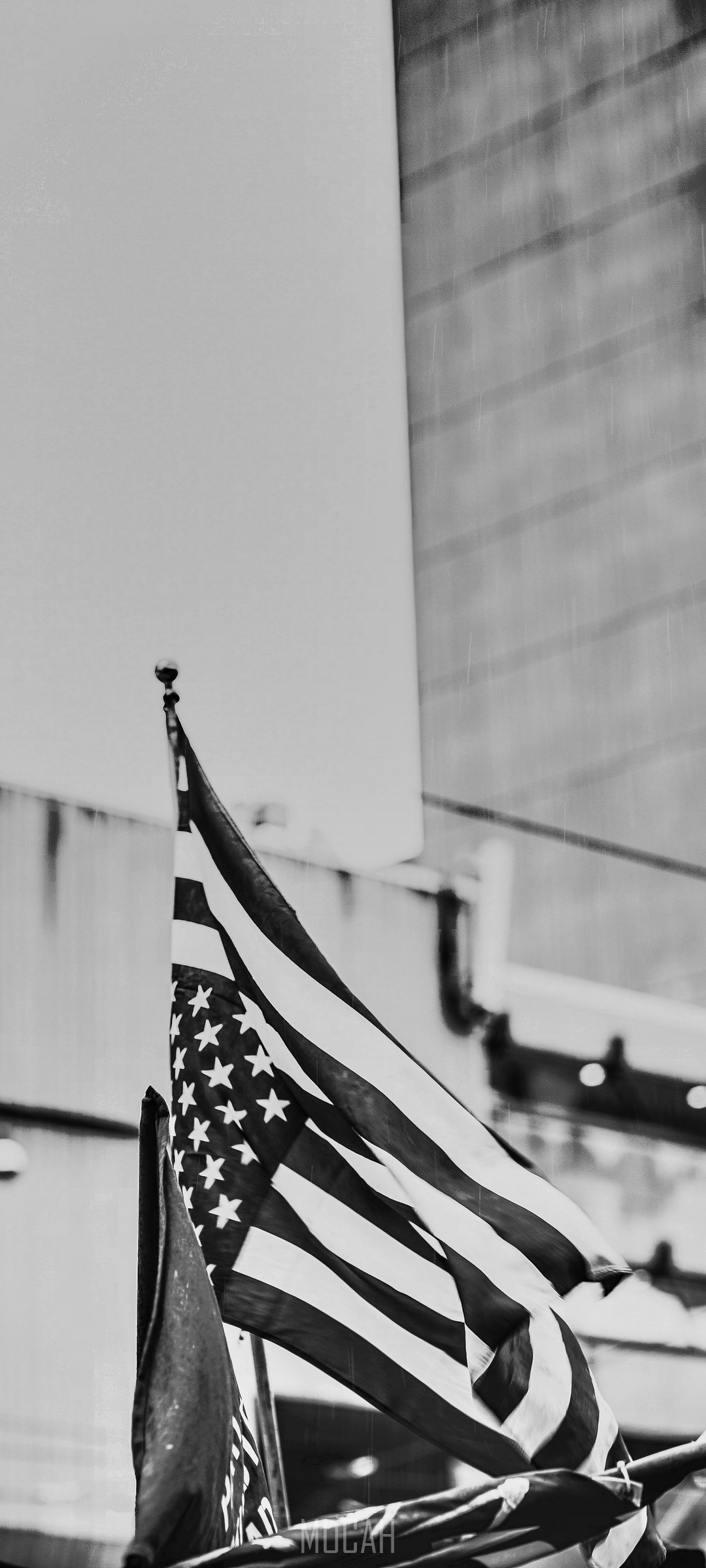 American flag waving in front of a building HD Phone Wallpaper