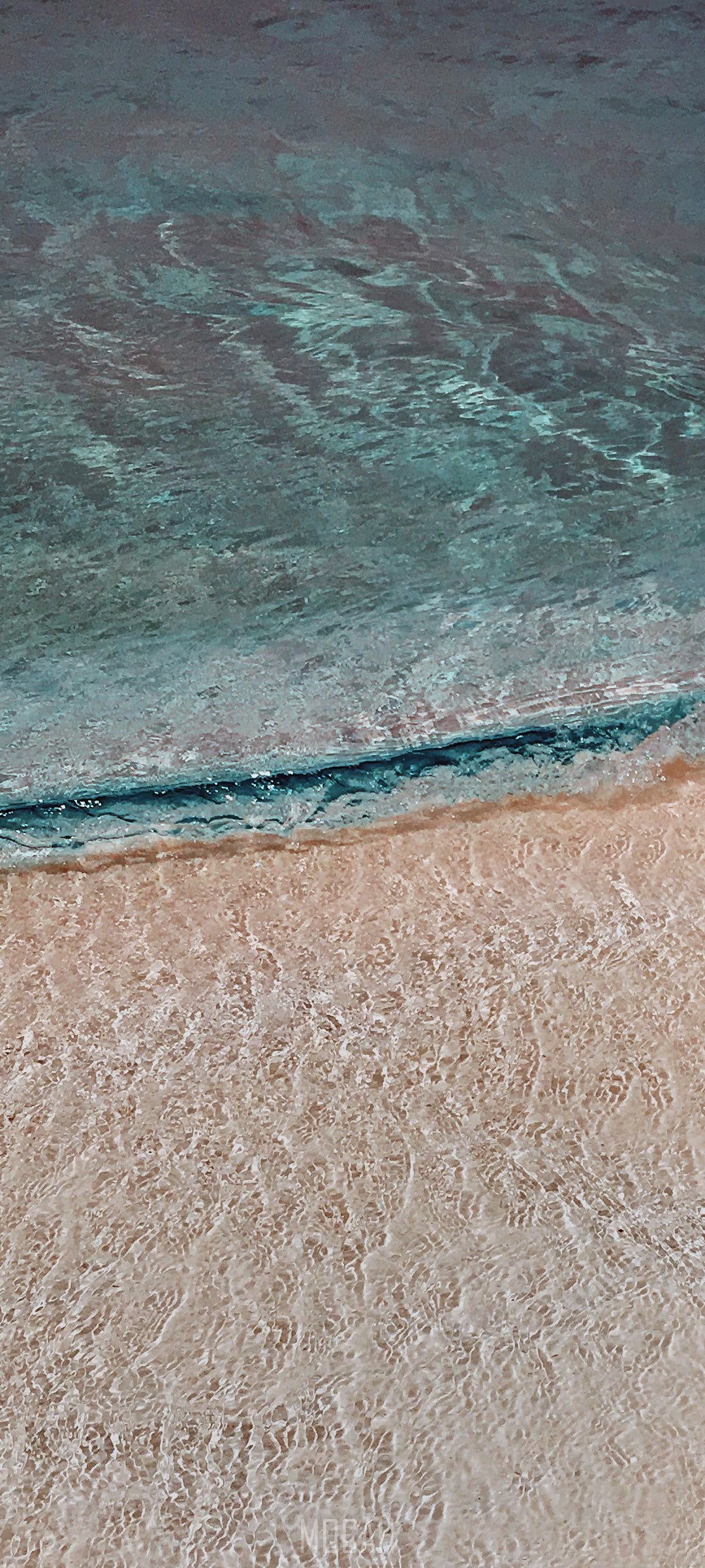 Ocean wave rolling onto a sandy beach HD Phone Wallpaper