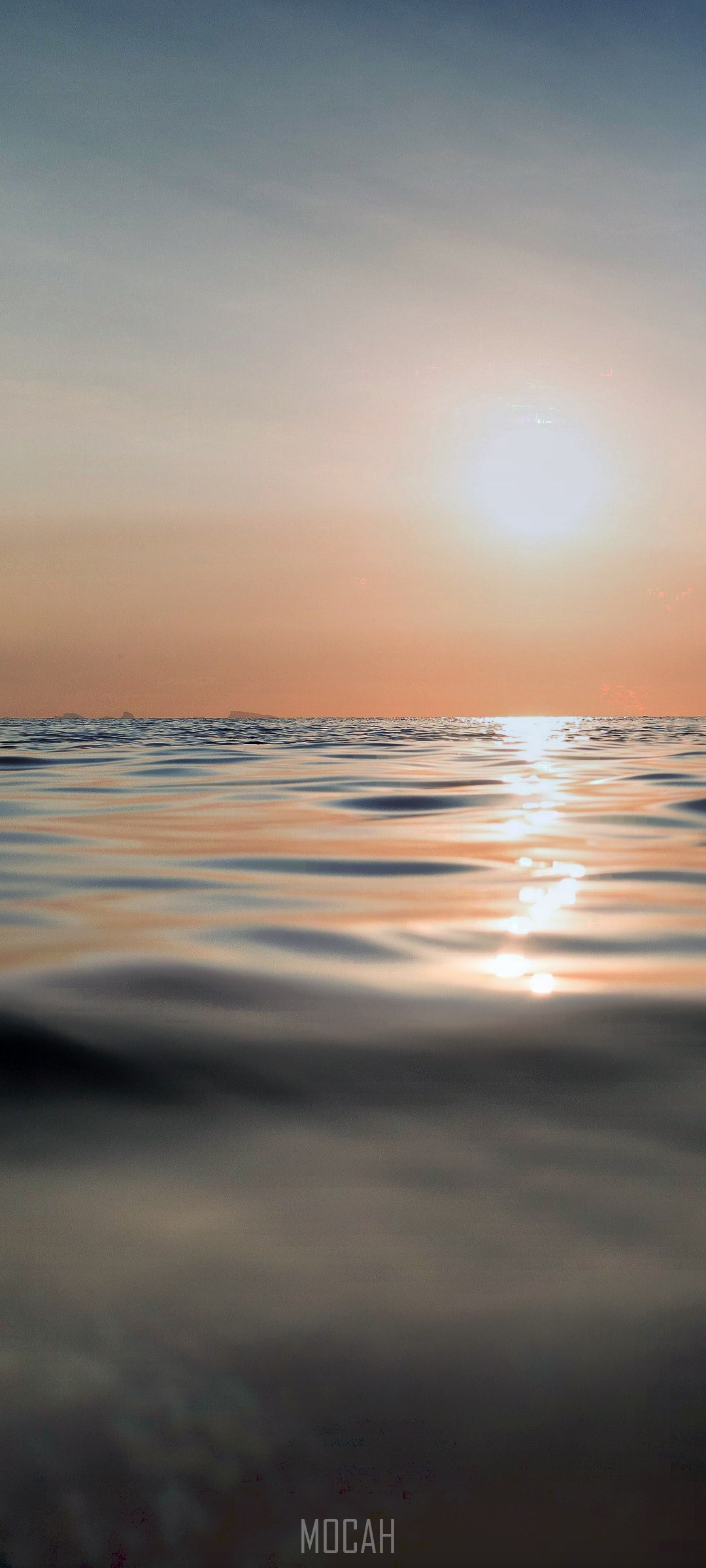 Sunset over the ocean with ripples HD Phone Wallpaper