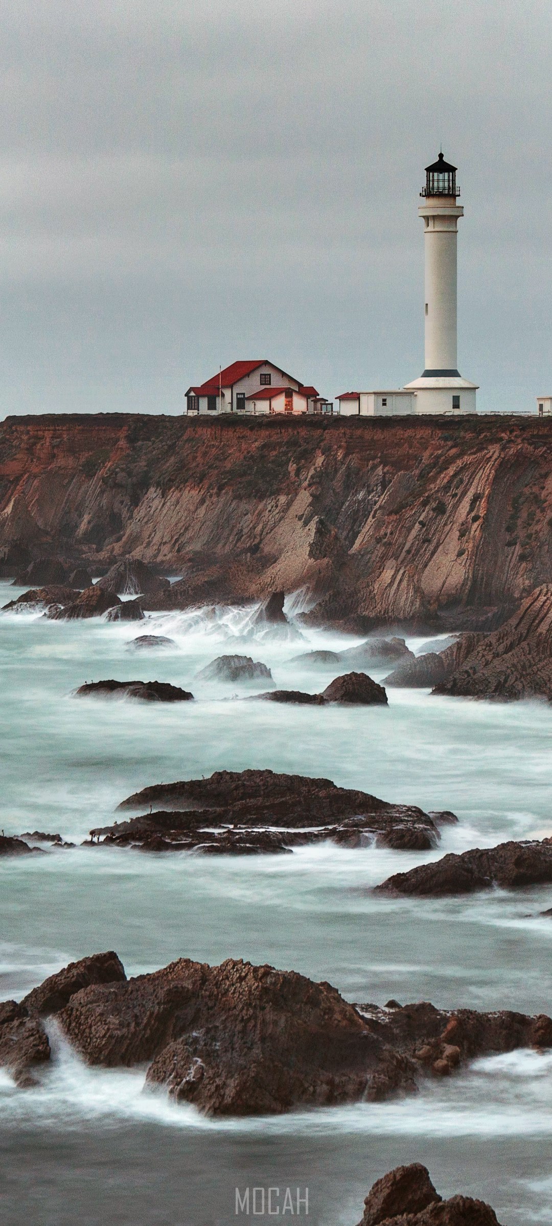 Point Arena Lighthouse on a cliff overlooking the ocean HD Phone Wallpaper