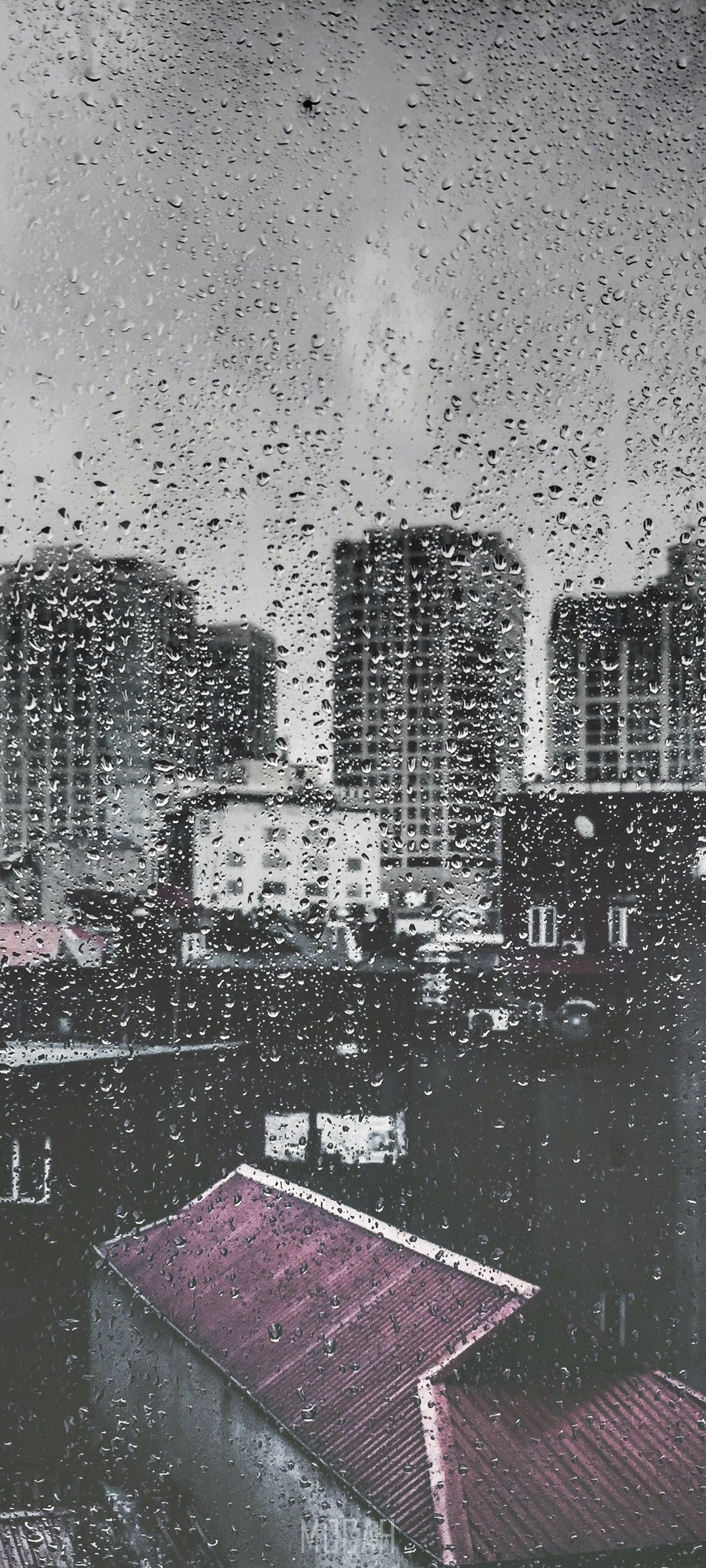 Rainy city view through a window with skyscrapers and rooftops HD Phone Wallpaper