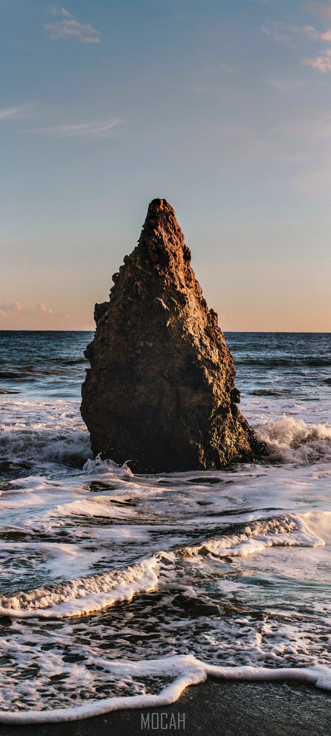 Jagged rock formation in the ocean with waves HD Phone Wallpaper