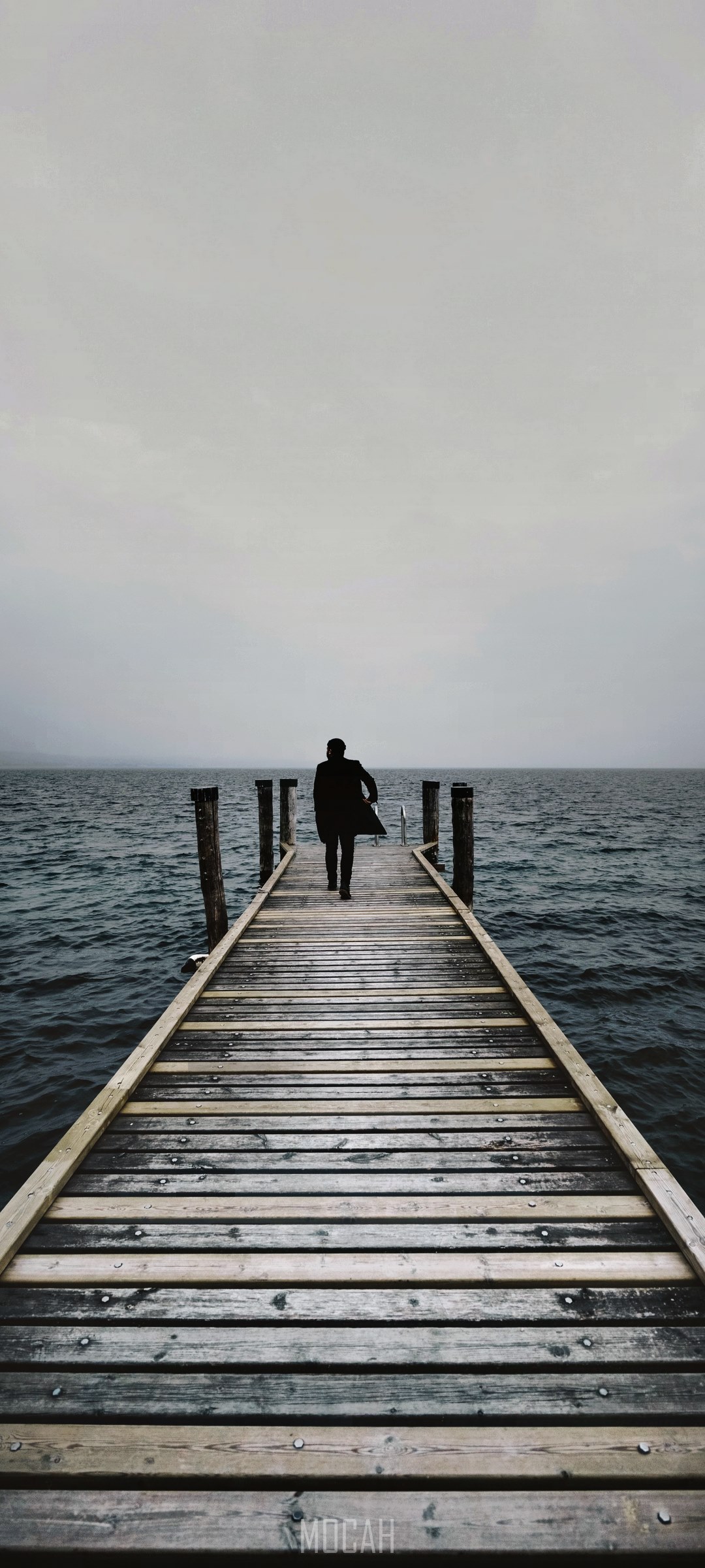 Person walking on a pier on a misty morning HD Phone Wallpaper
