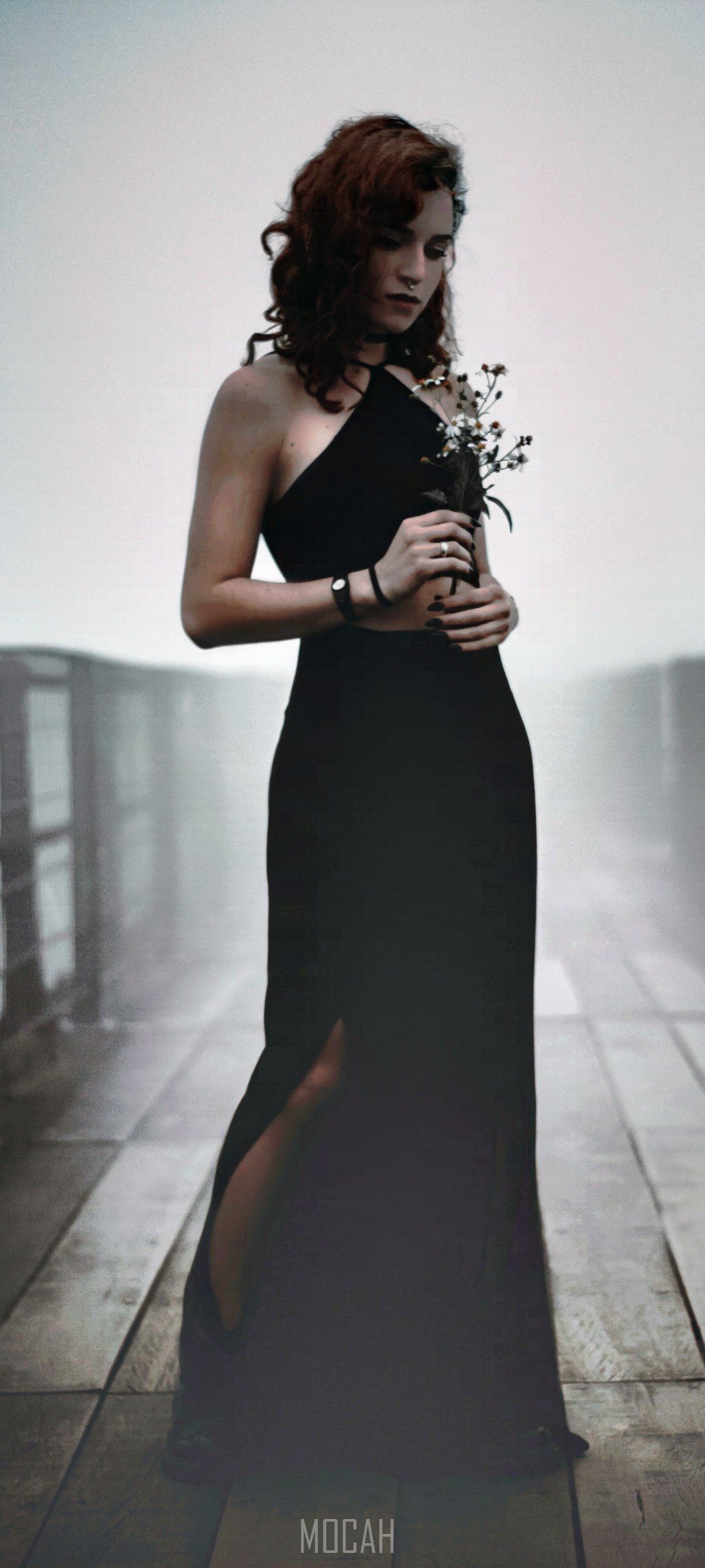 Woman in black dress holding flowers HD Phone Wallpaper