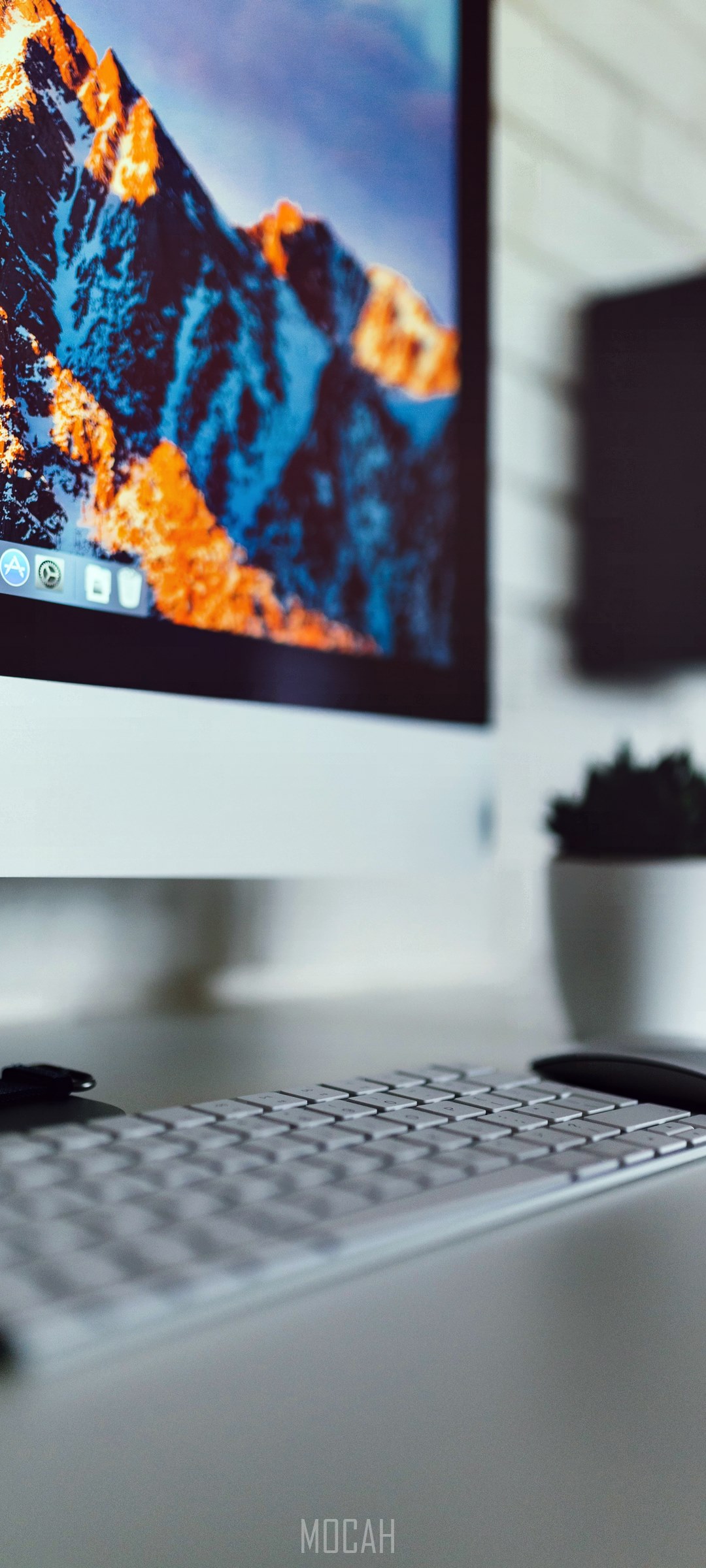Apple computer with mountain wallpaper and keyboard HD Phone Wallpaper