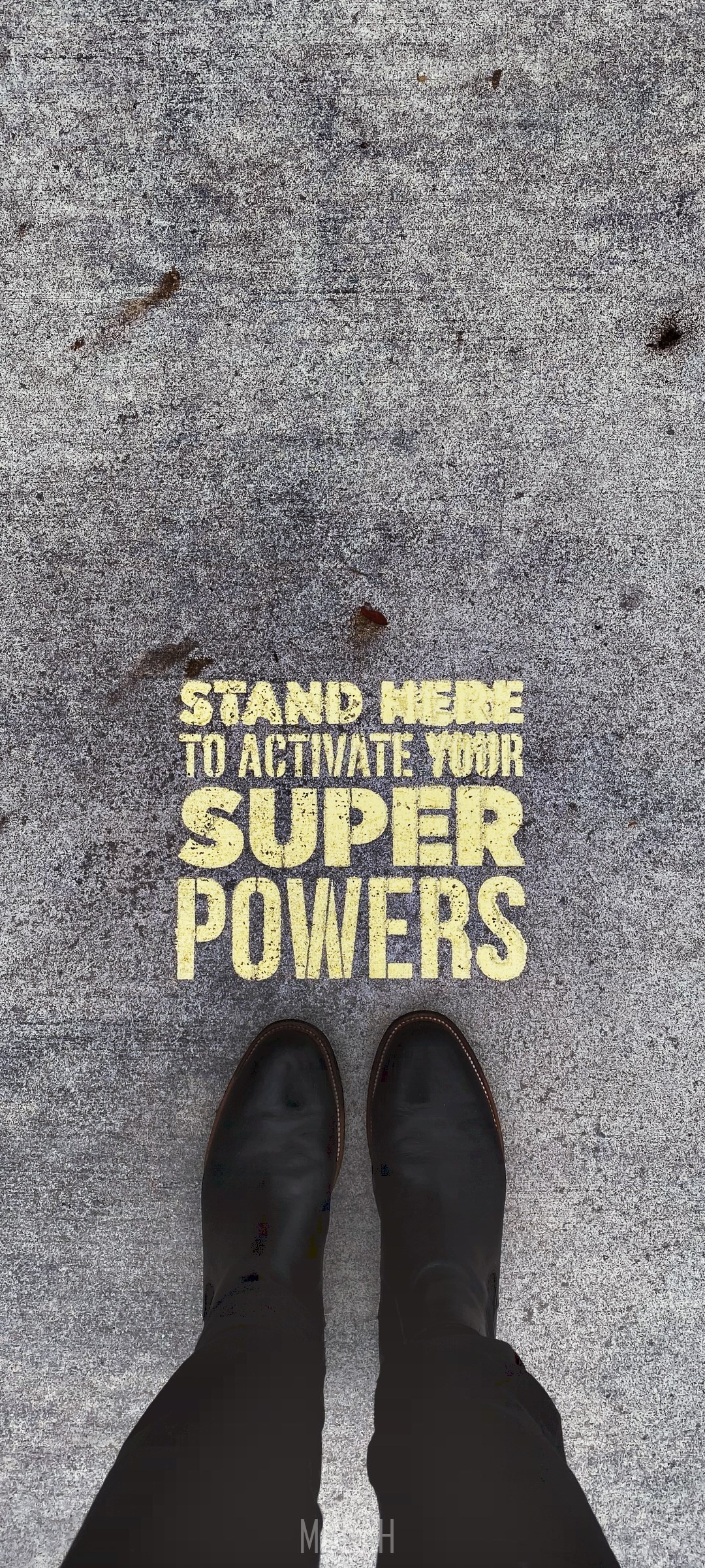 Text on concrete: Stand here to activate your superpowers HD Phone Wallpaper