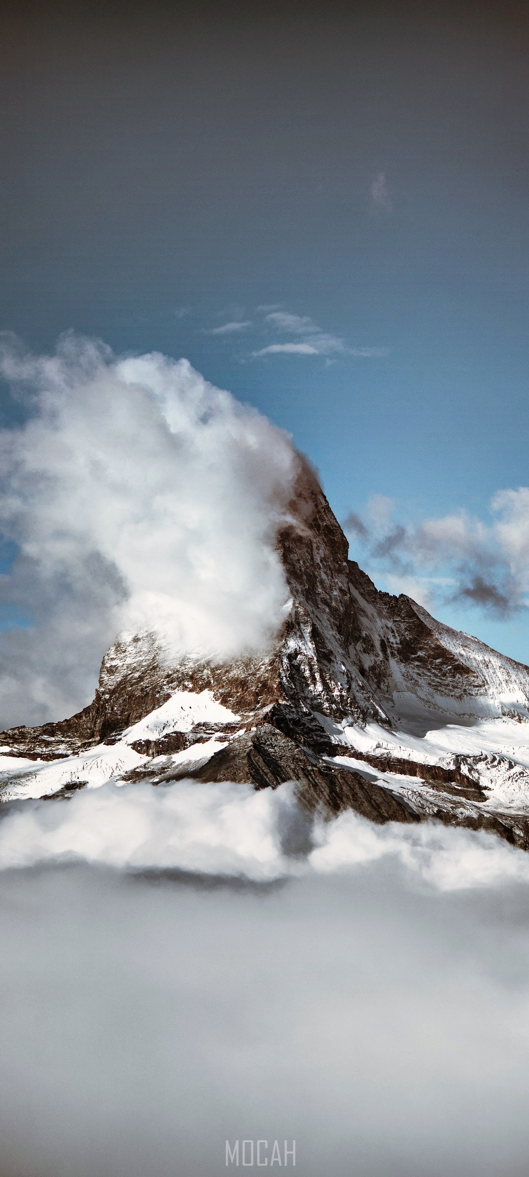 Matterhorn mountain peak covered in snow and clouds HD Phone Wallpaper