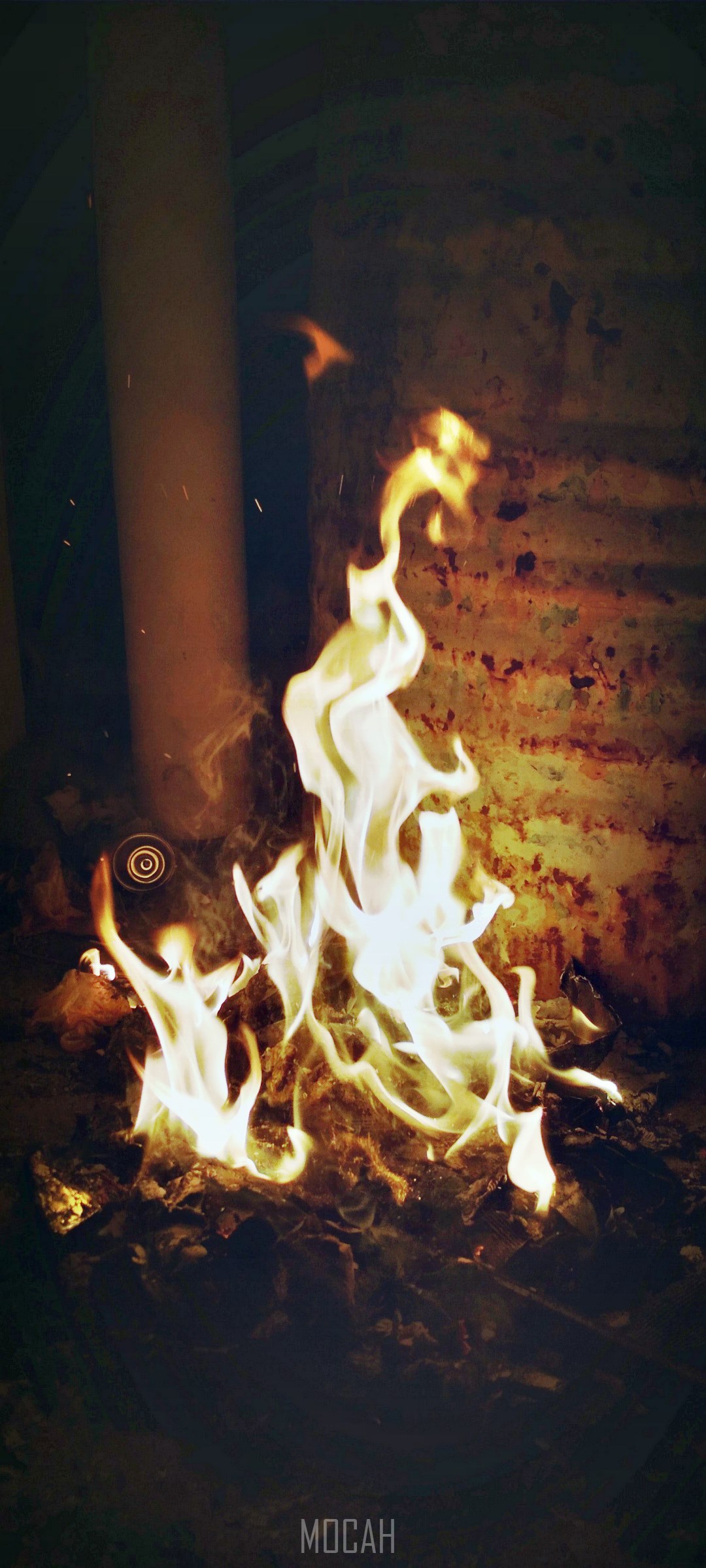 Fire burning in a dark room with a pipe HD Phone Wallpaper