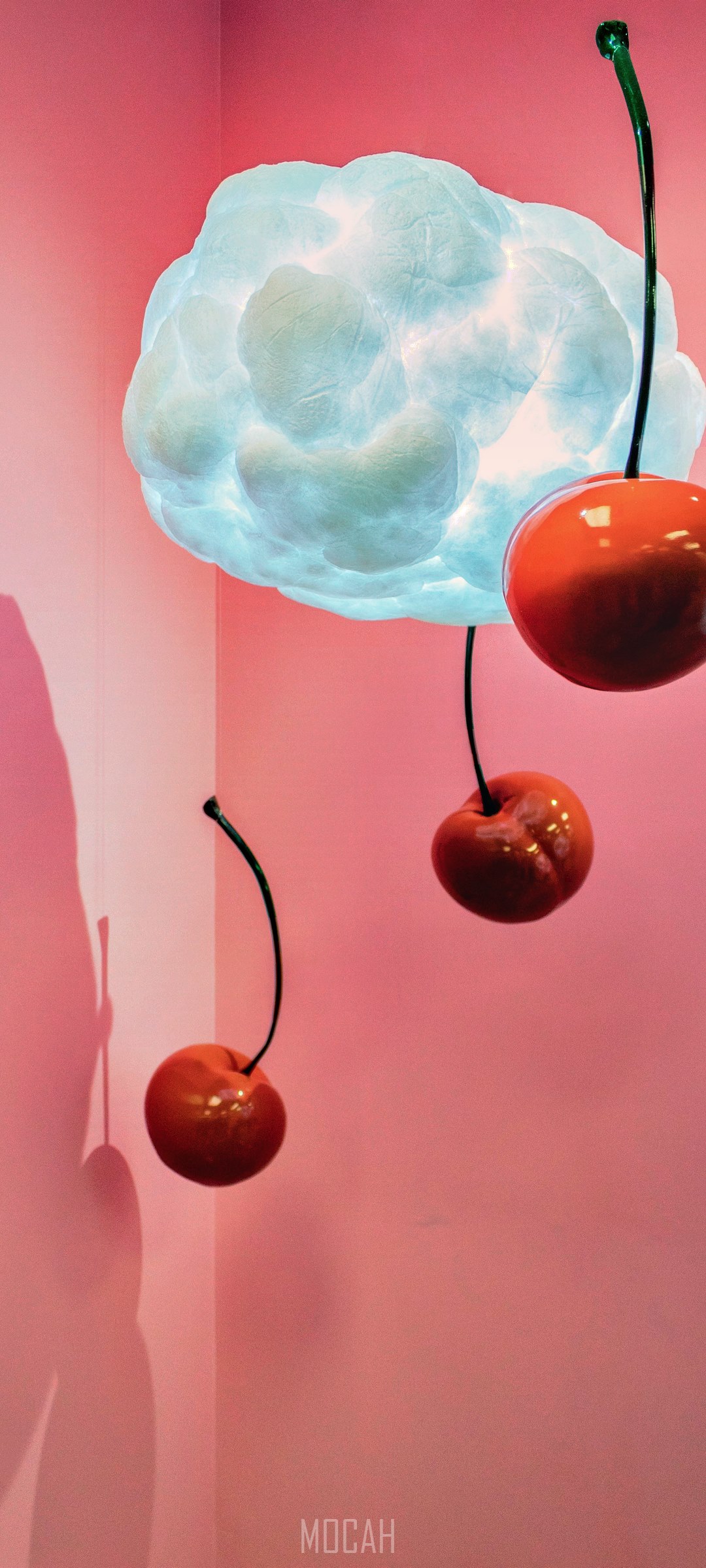 Cherries hanging from a cloud lamp HD Phone Wallpaper