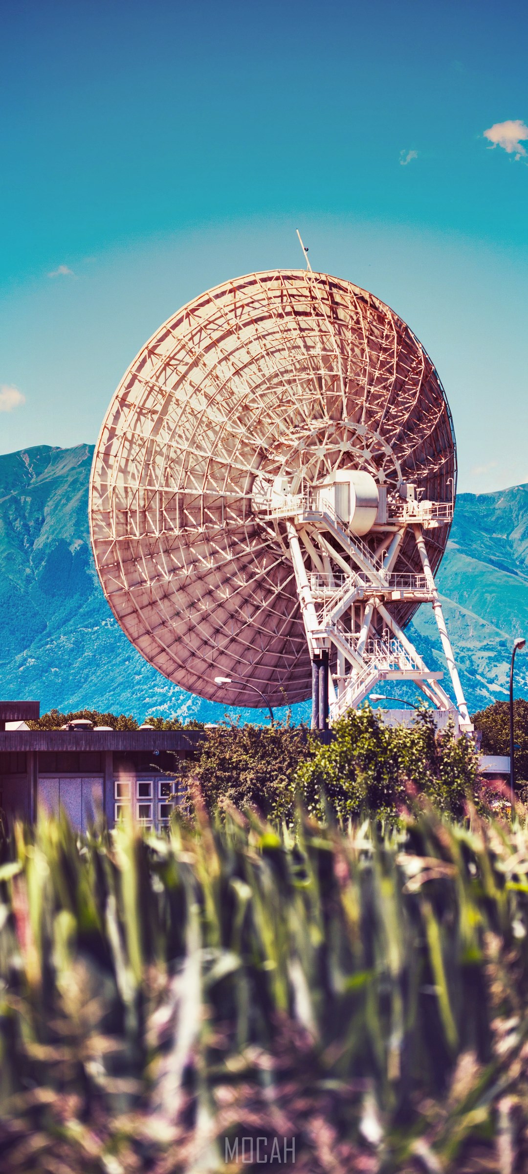 Satellite dish in a field with mountains HD Phone Wallpaper