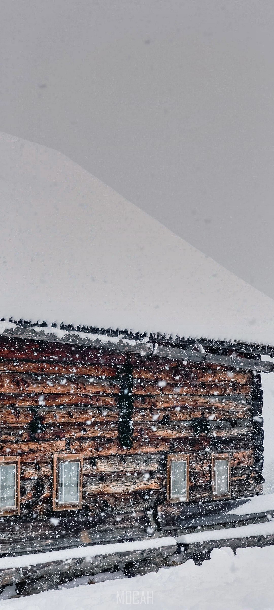 Snow covered ski lodge in Austria during snowfall HD Phone Wallpaper