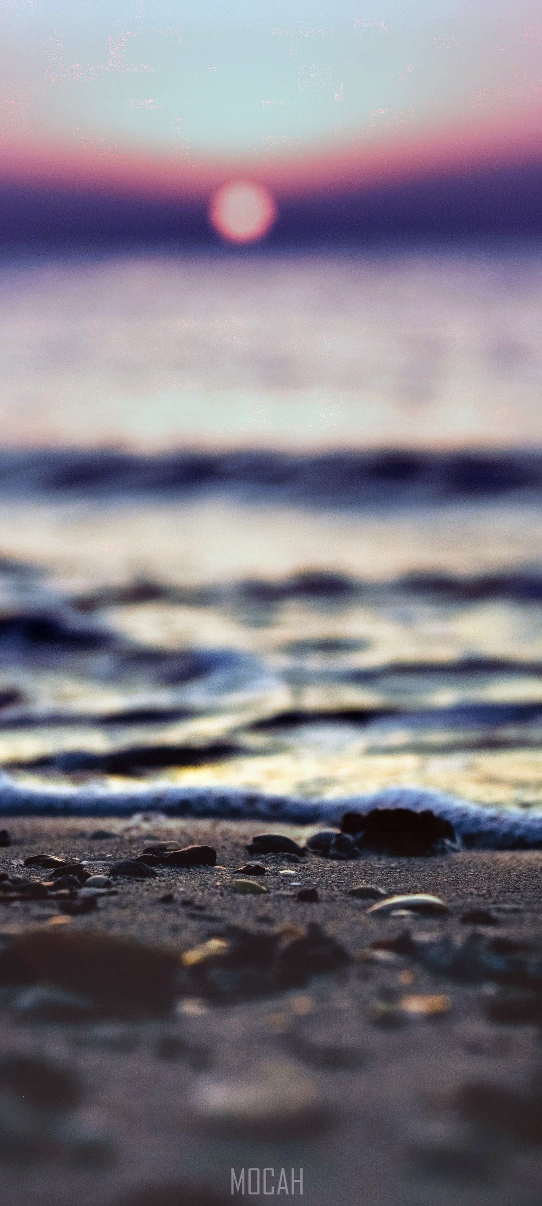 Sunset over the ocean with a pebble beach HD Phone Wallpaper