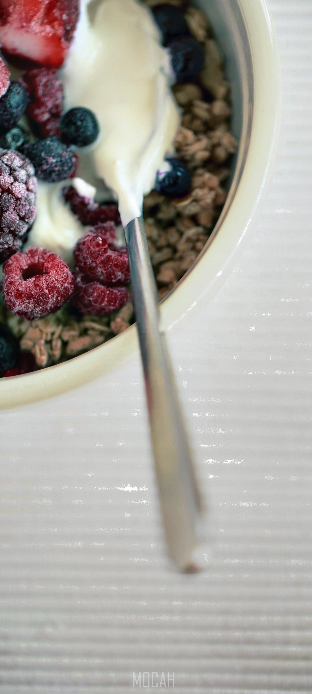 Yogurt with granola and mixed berries in a bowl HD Phone Wallpaper