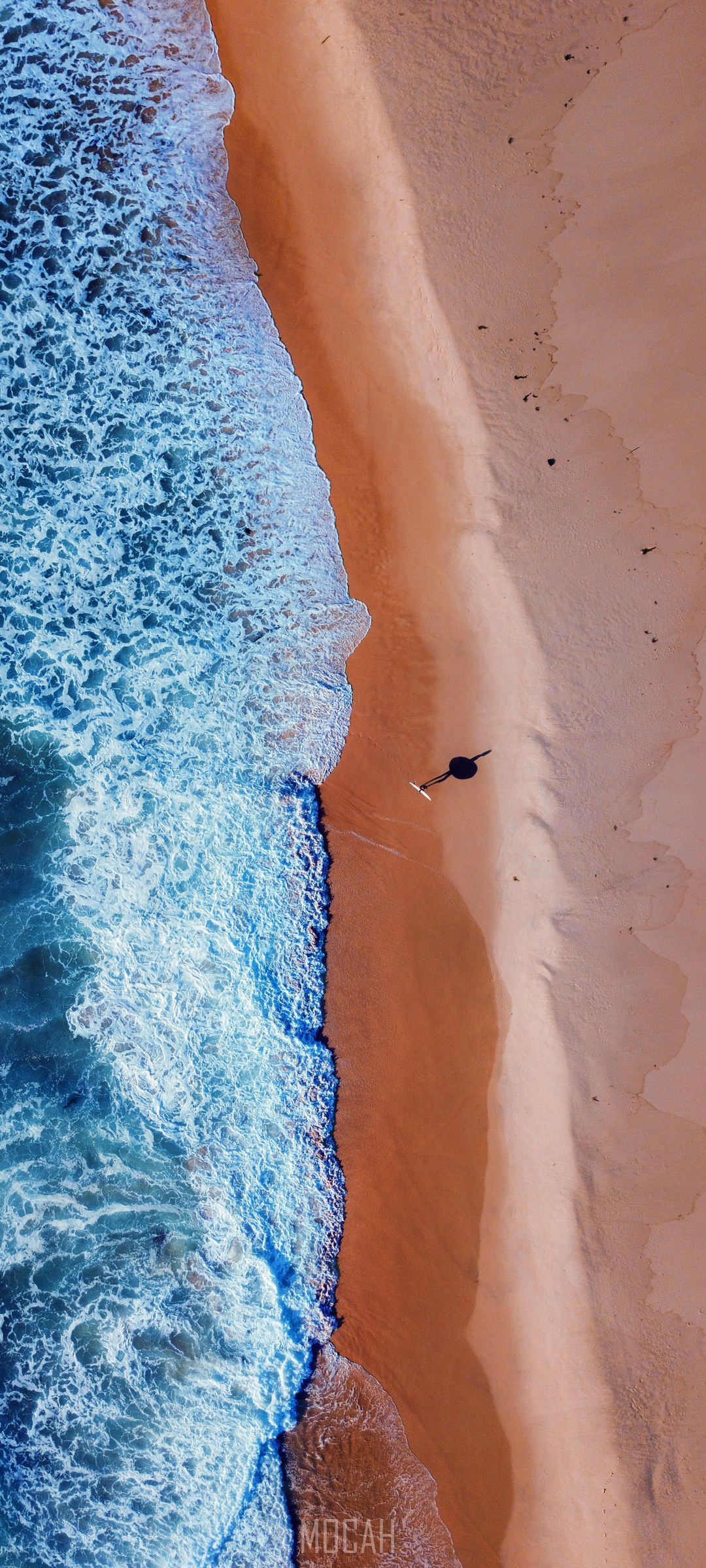 Person walking on a beach with waves HD Phone Wallpaper