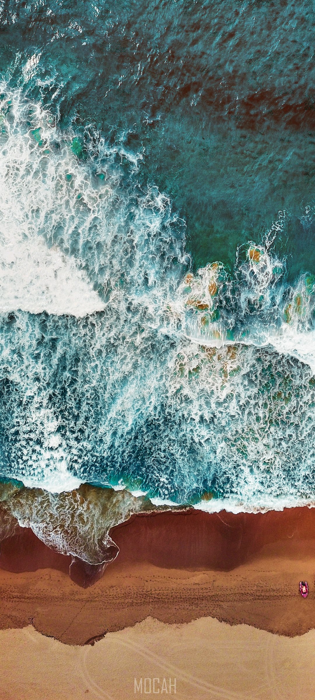 Aerial view of ocean waves crashing on a sandy beach HD Phone Wallpaper