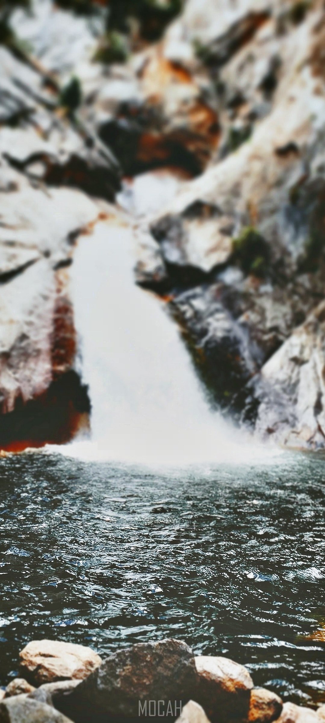 Waterfall cascading into a rocky pool HD Phone Wallpaper