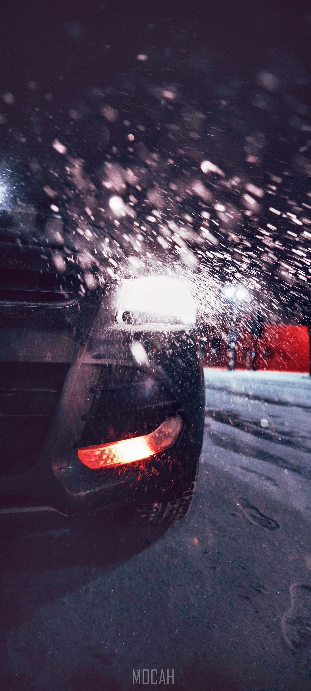 Car headlamp with snow falling HD Phone Wallpaper