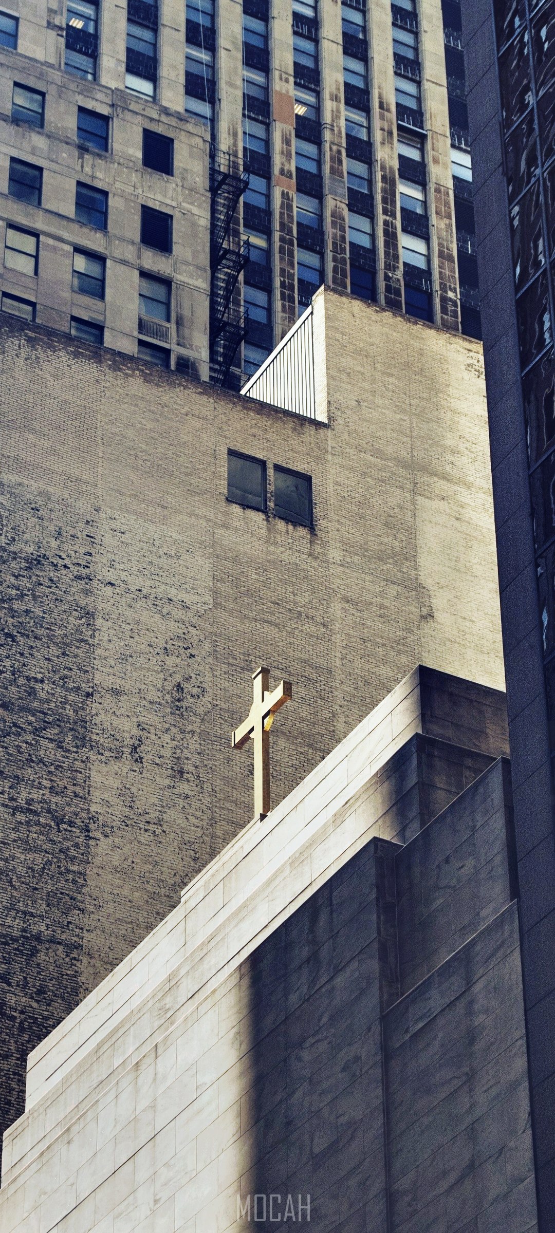 Cross on a church building among skyscrapers HD Phone Wallpaper