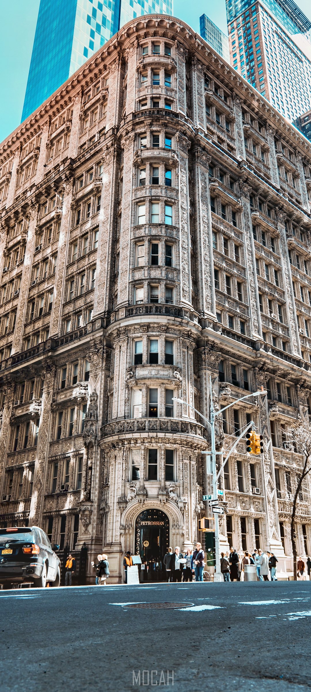 Ornate building facade with modern skyscrapers behind HD Phone Wallpaper