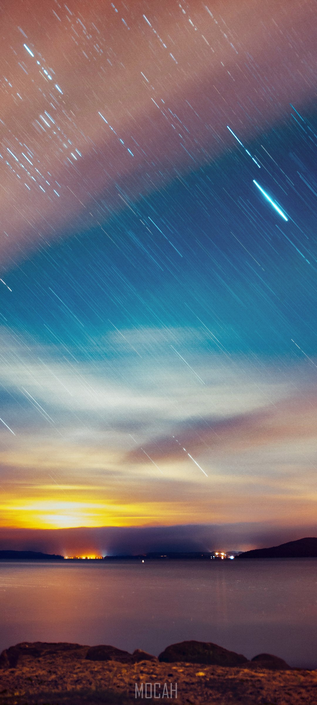 Star trails over a lake at sunset HD Phone Wallpaper