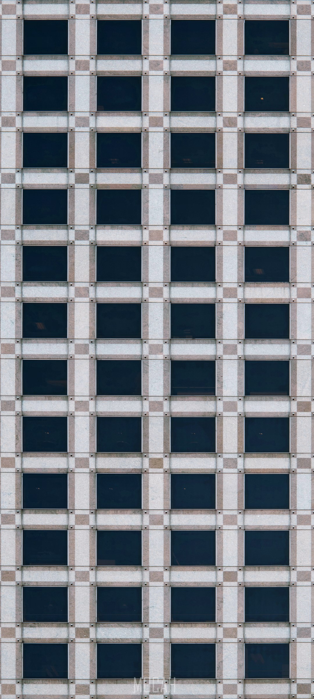 Grid pattern of windows on a building facade HD Phone Wallpaper