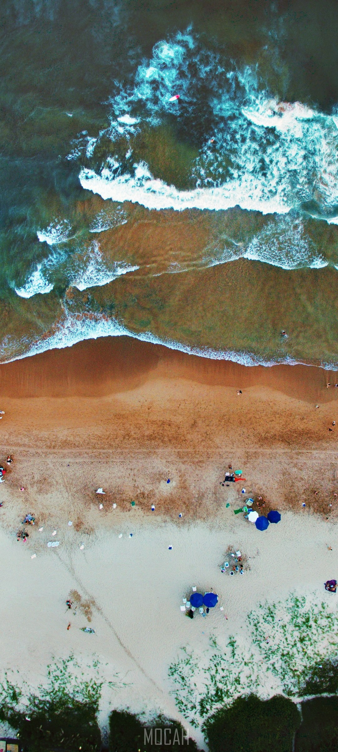 Aerial view of waves on a beach with people and umbrellas HD Phone Wallpaper