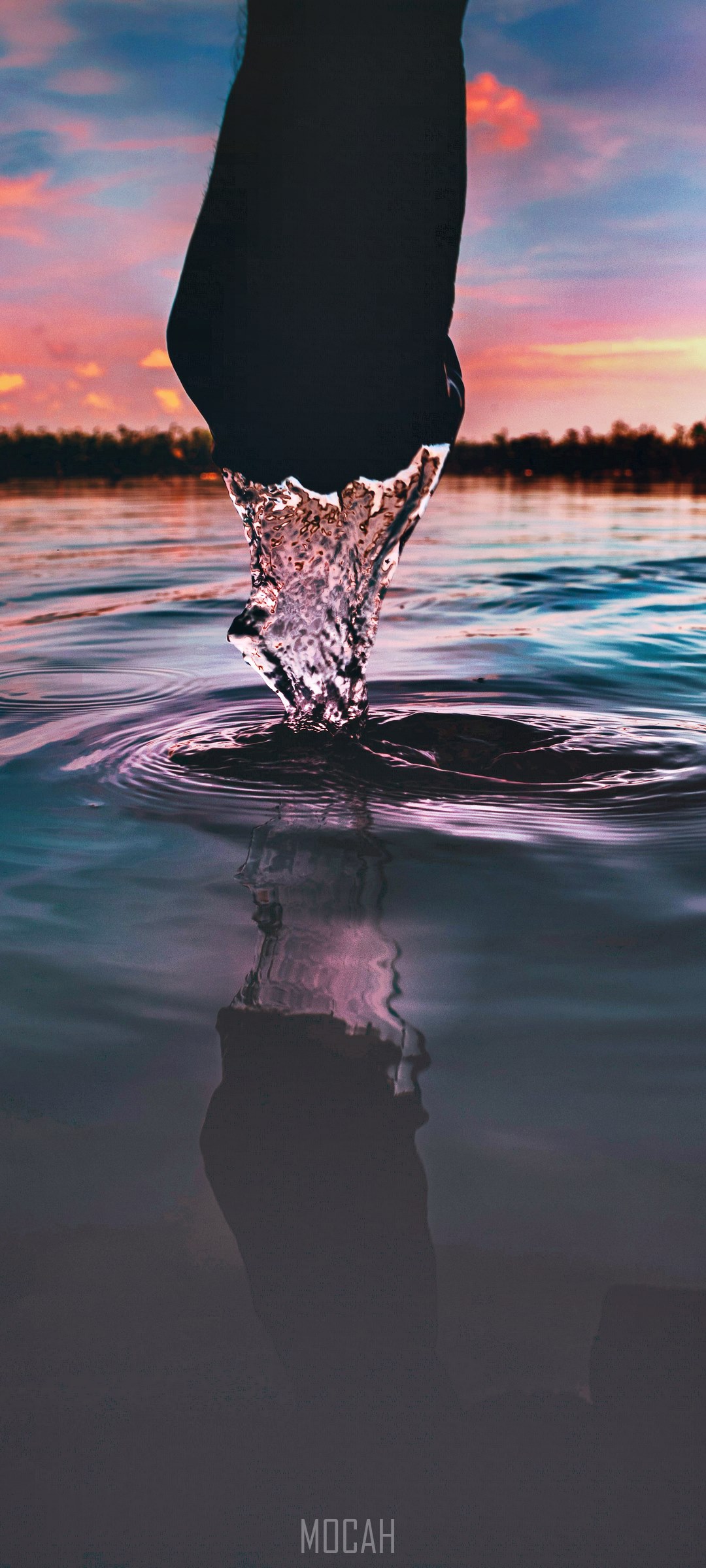 Hand splashing water at sunset HD Phone Wallpaper