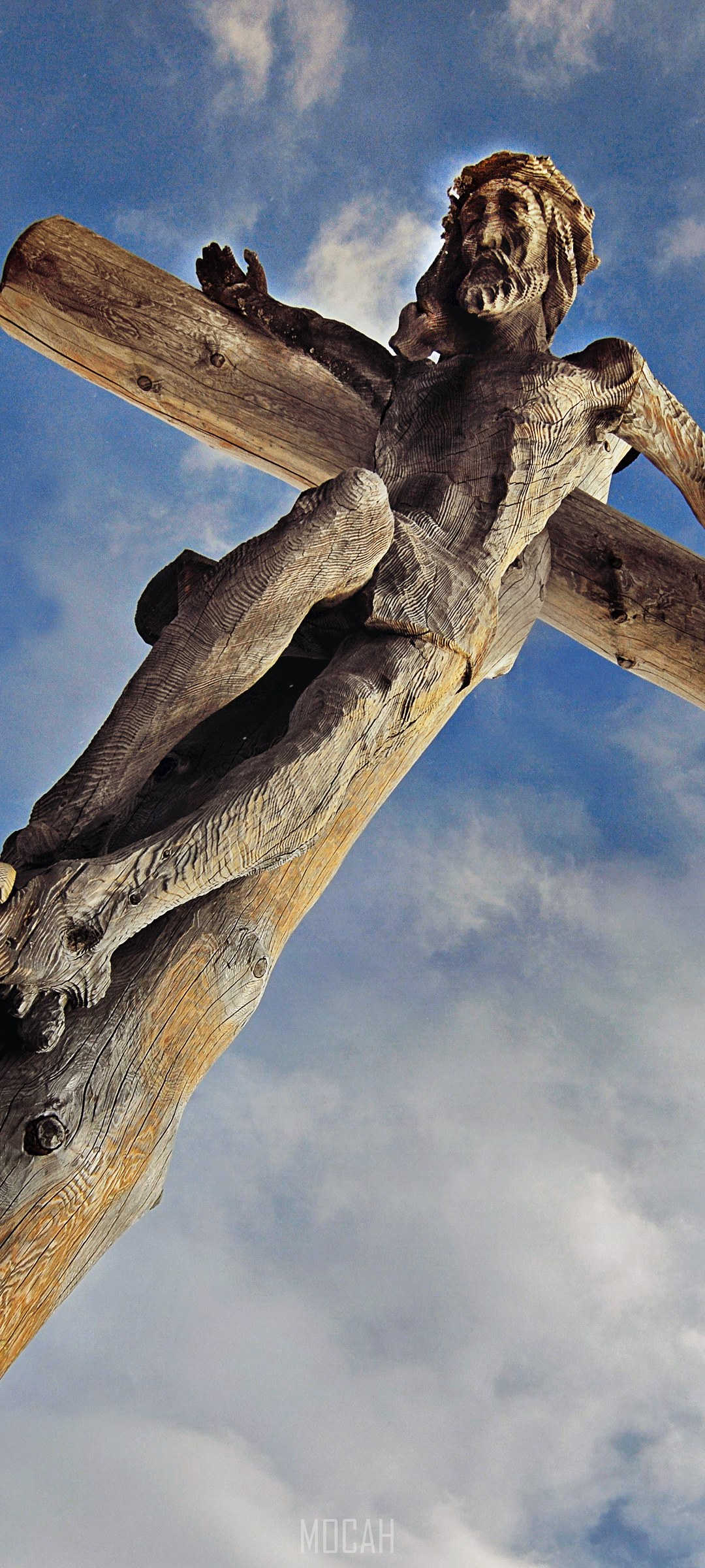 Wooden Jesus sculpture on a cross against the sky HD Phone Wallpaper