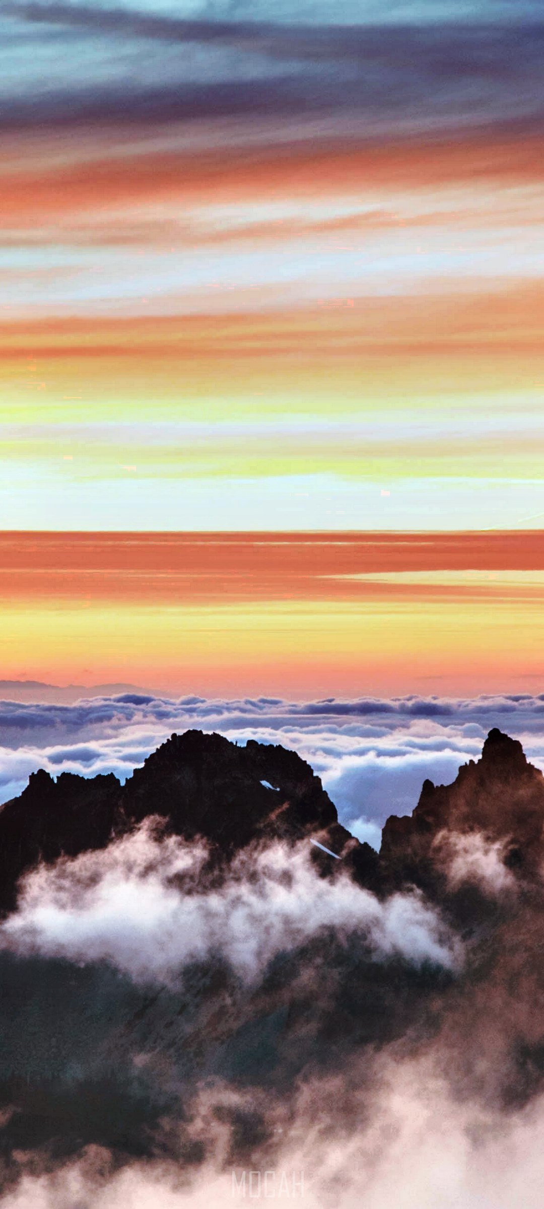 Jagged mountain peaks emerge from clouds at sunset HD Phone Wallpaper