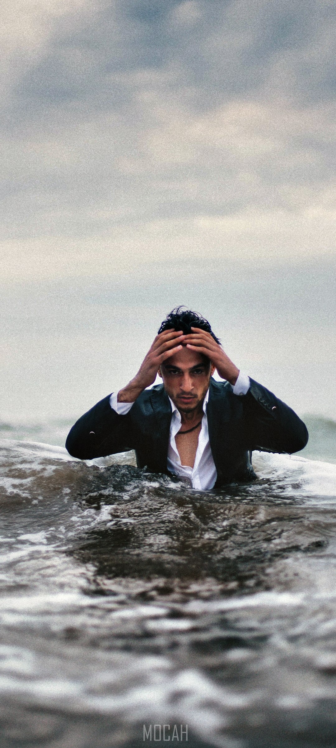 Man in suit in ocean waves HD Phone Wallpaper