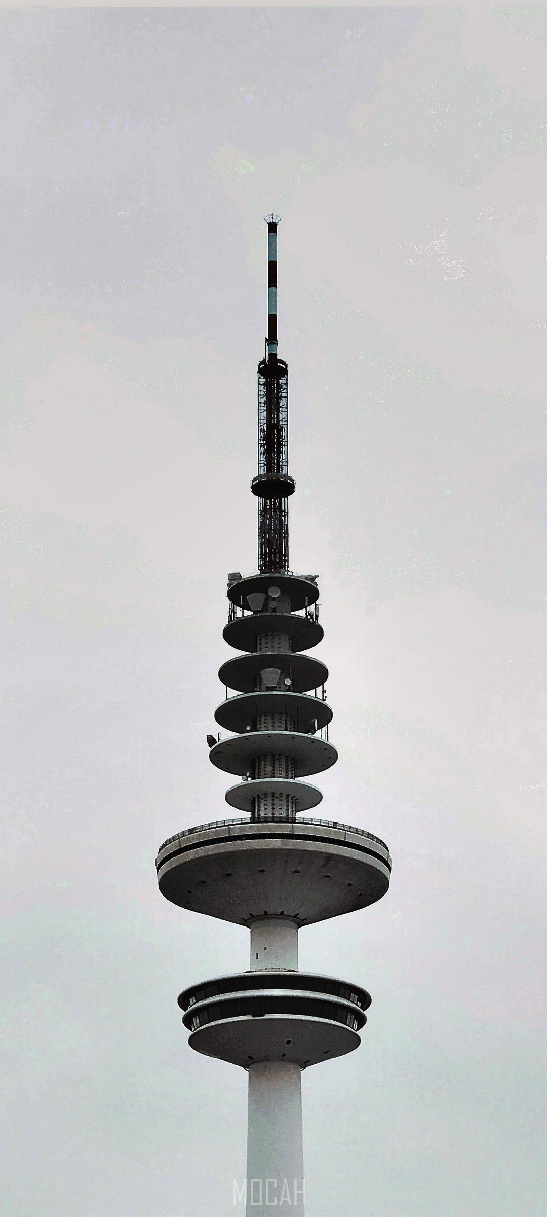 Communications tower in Hamburg against a cloudy sky HD Phone Wallpaper