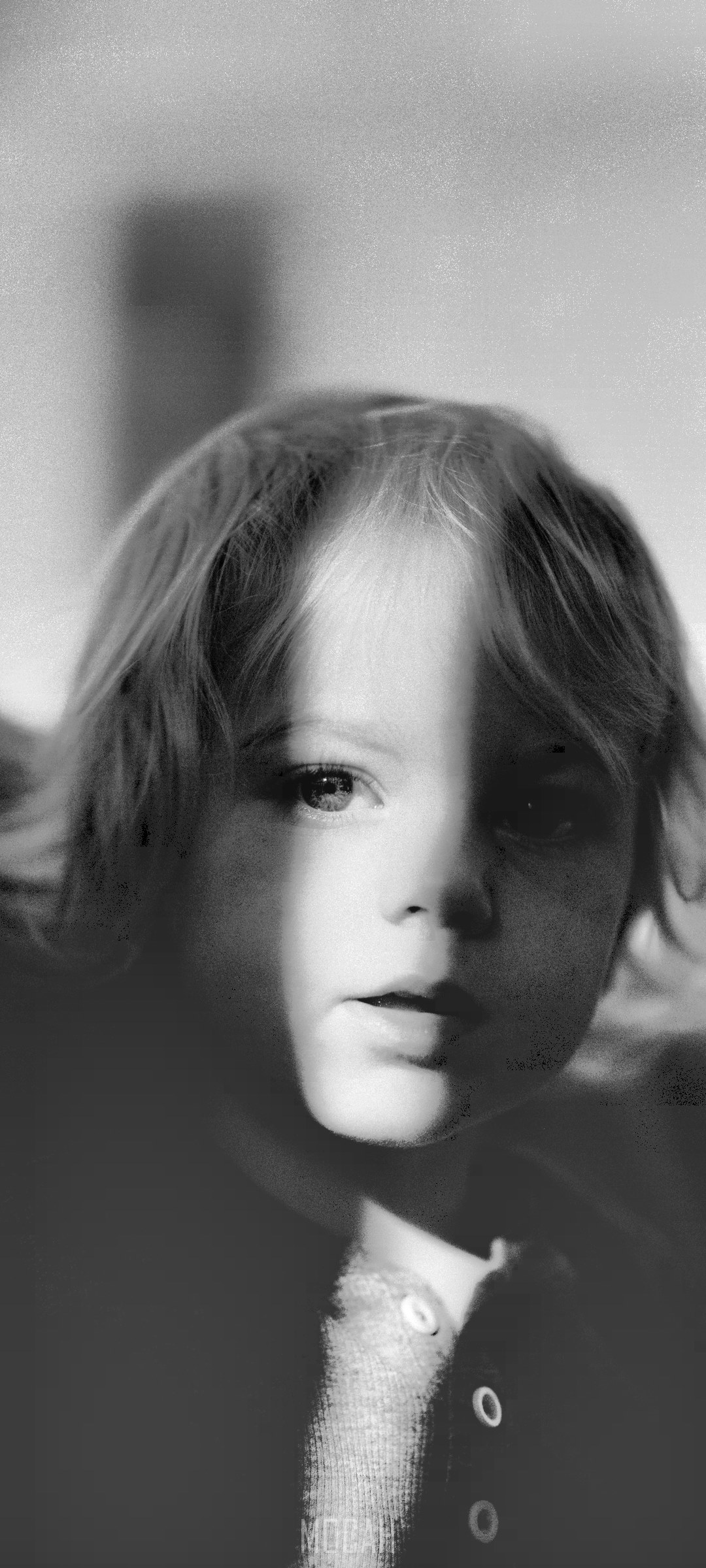 Black and white portrait of a child with light and shadow on face HD Phone Wallpaper