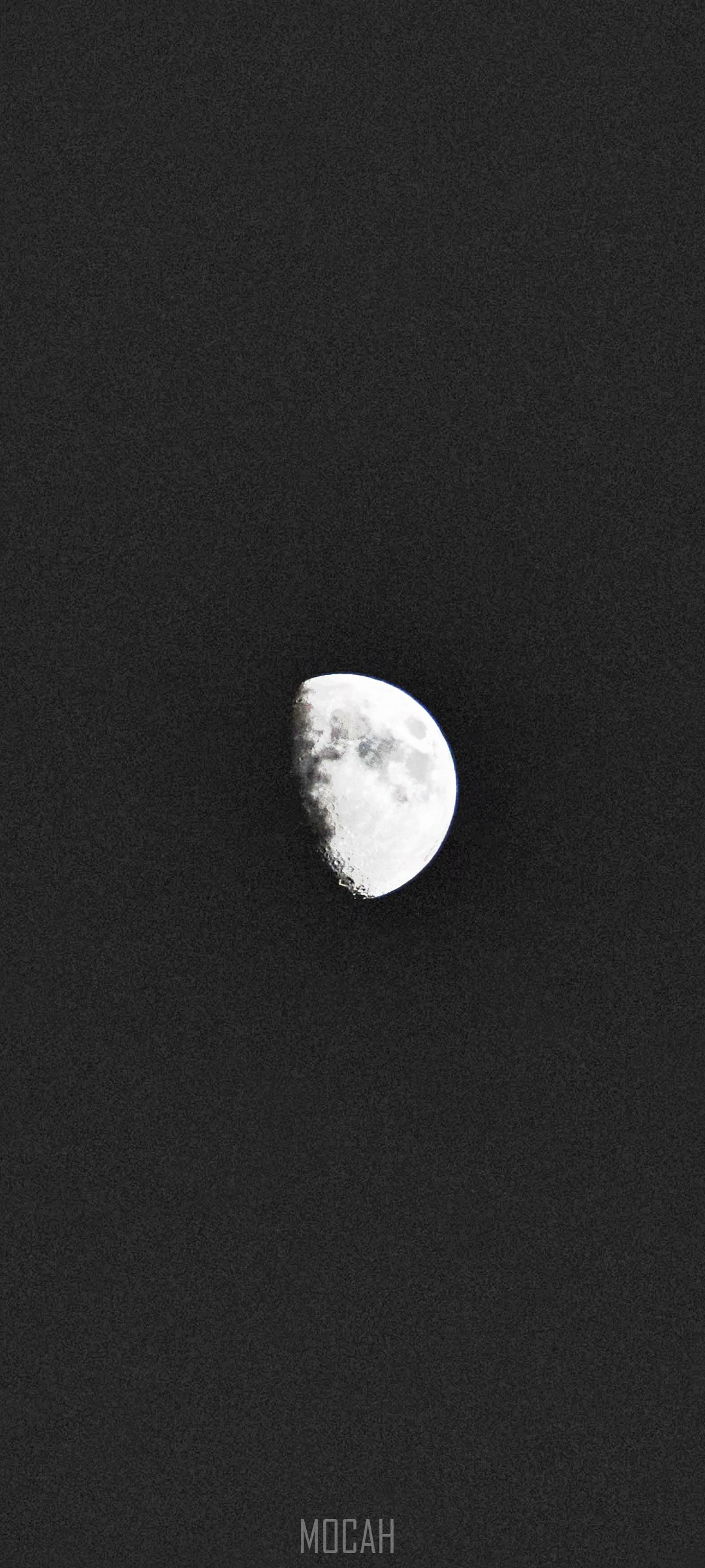 Half moon with dark spots in a black sky HD Phone Wallpaper