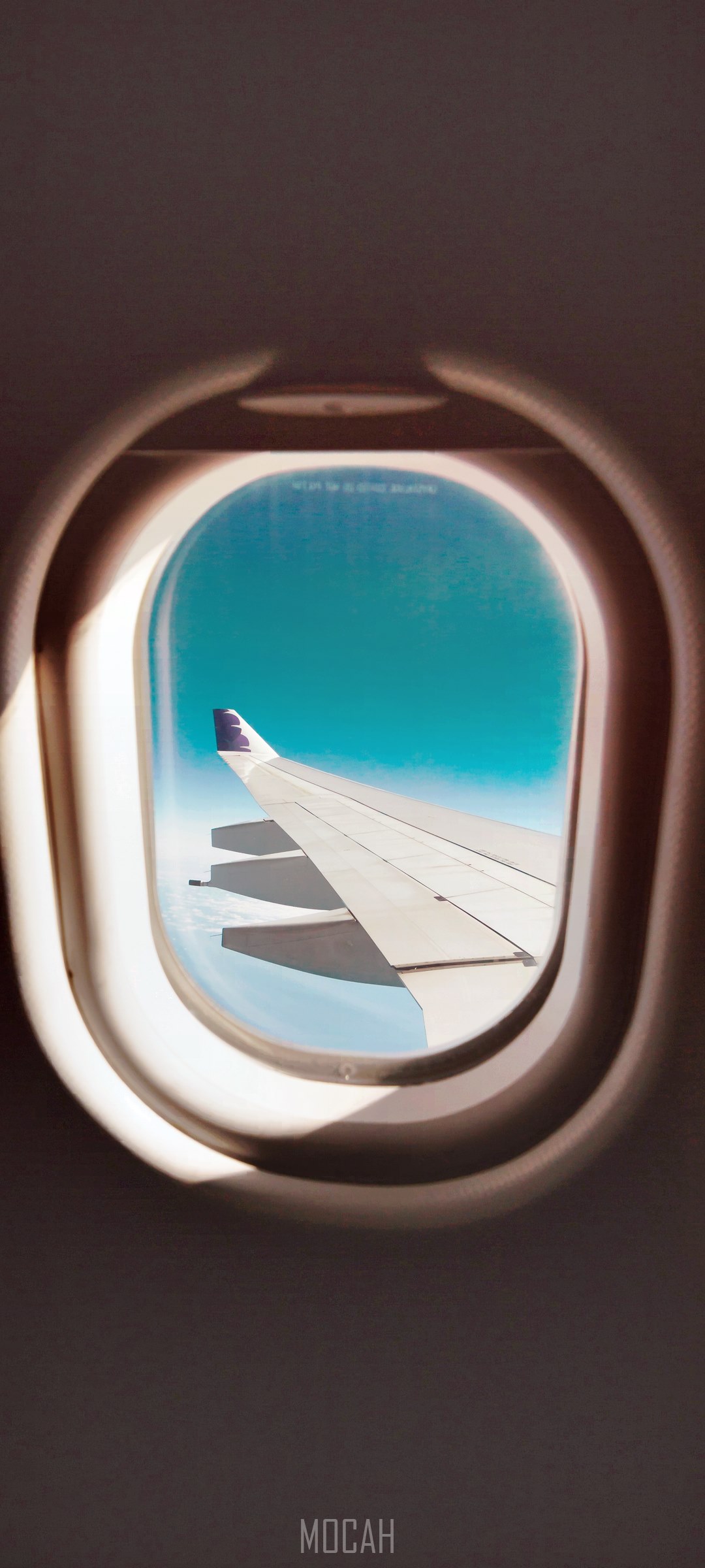 Airplane window view of wing and sky HD Phone Wallpaper