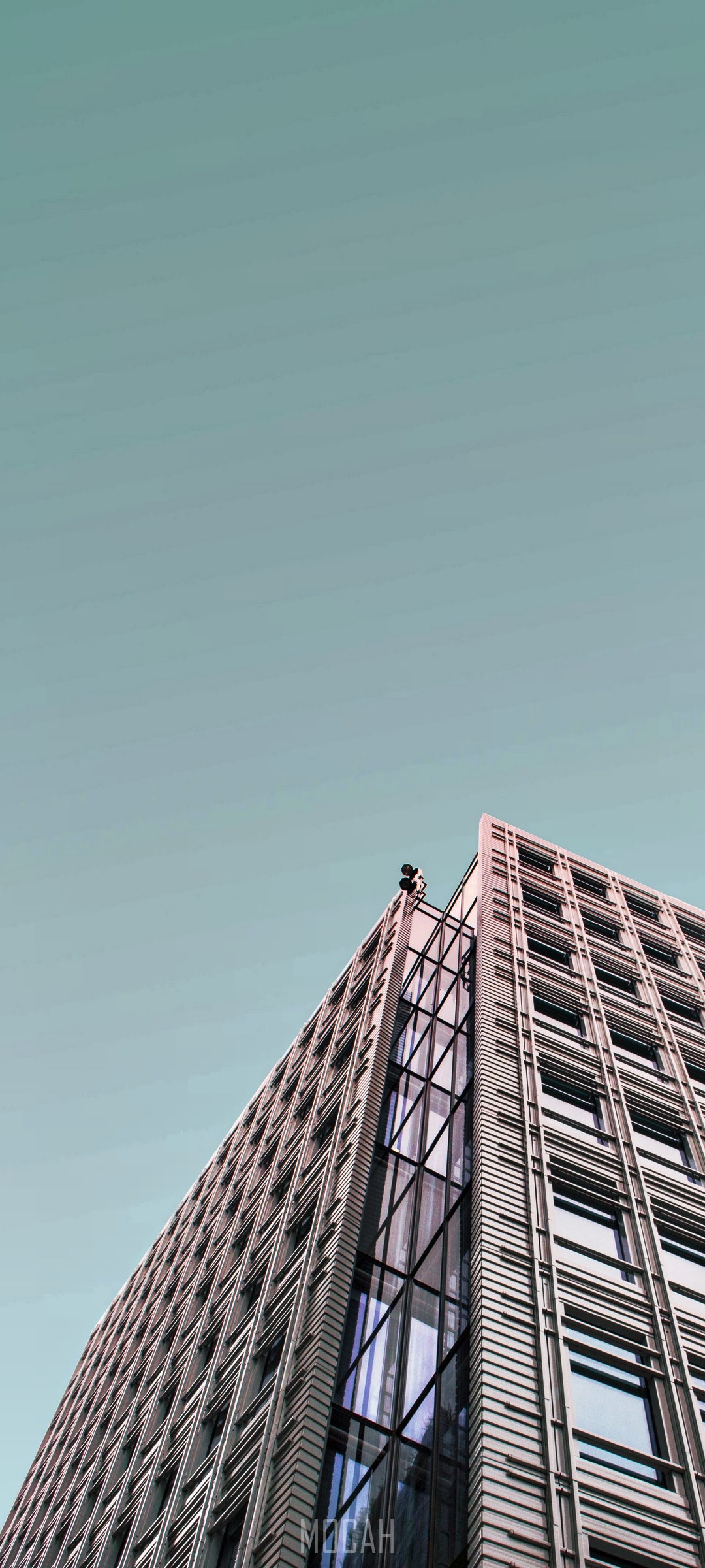 Modern building with a person on top HD Phone Wallpaper