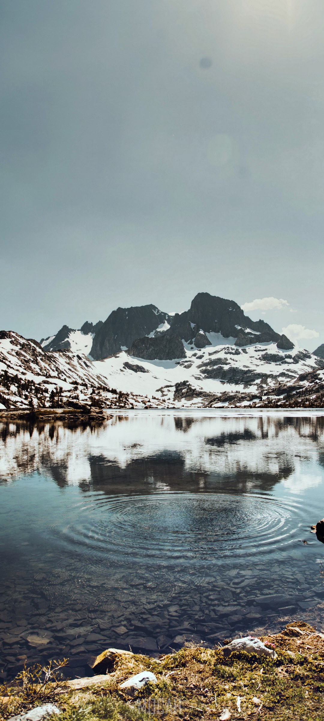 Snowy mountains reflected in a clear lake HD Phone Wallpaper