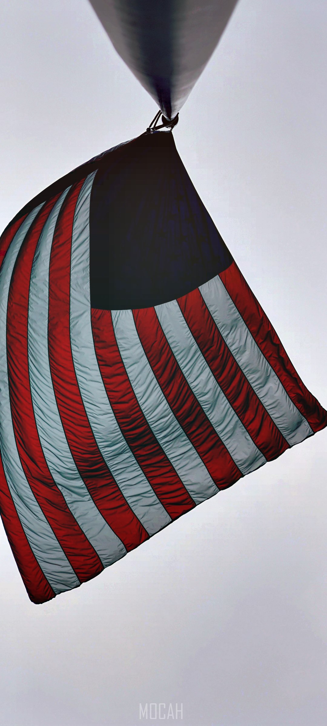 American flag on a pole against a cloudy sky HD Phone Wallpaper