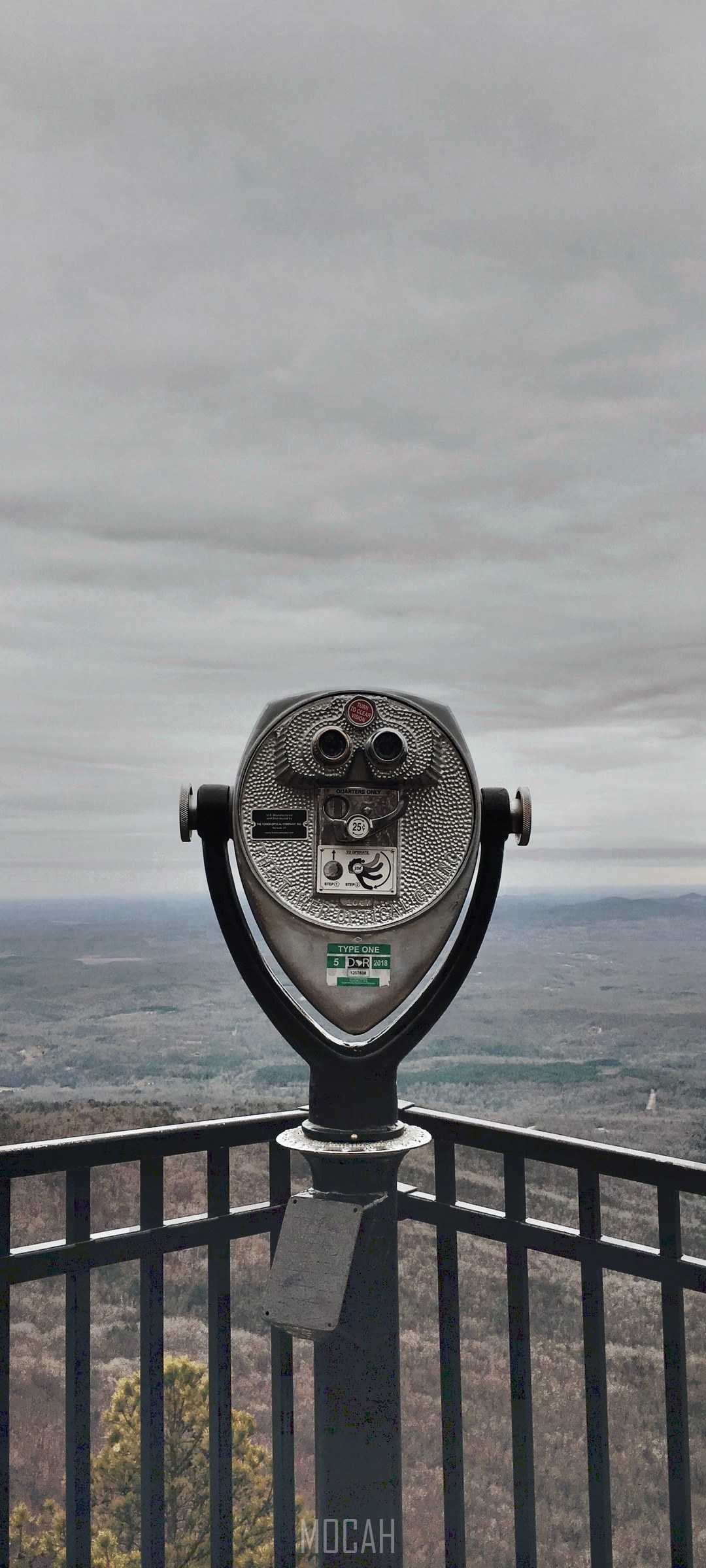 Binoculars on a scenic overlook with cloudy sky HD Phone Wallpaper