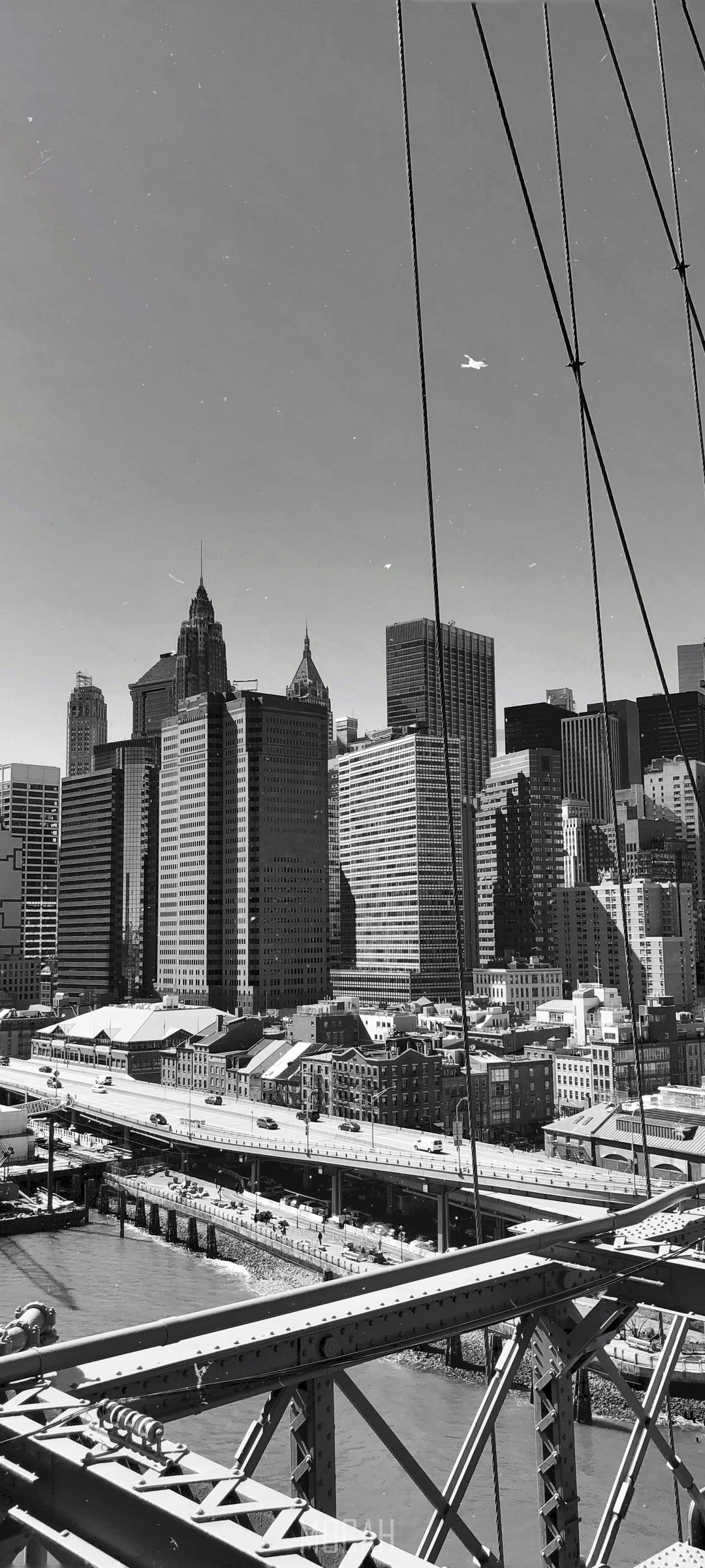 New York City skyline with Brooklyn Bridge cables HD Phone Wallpaper