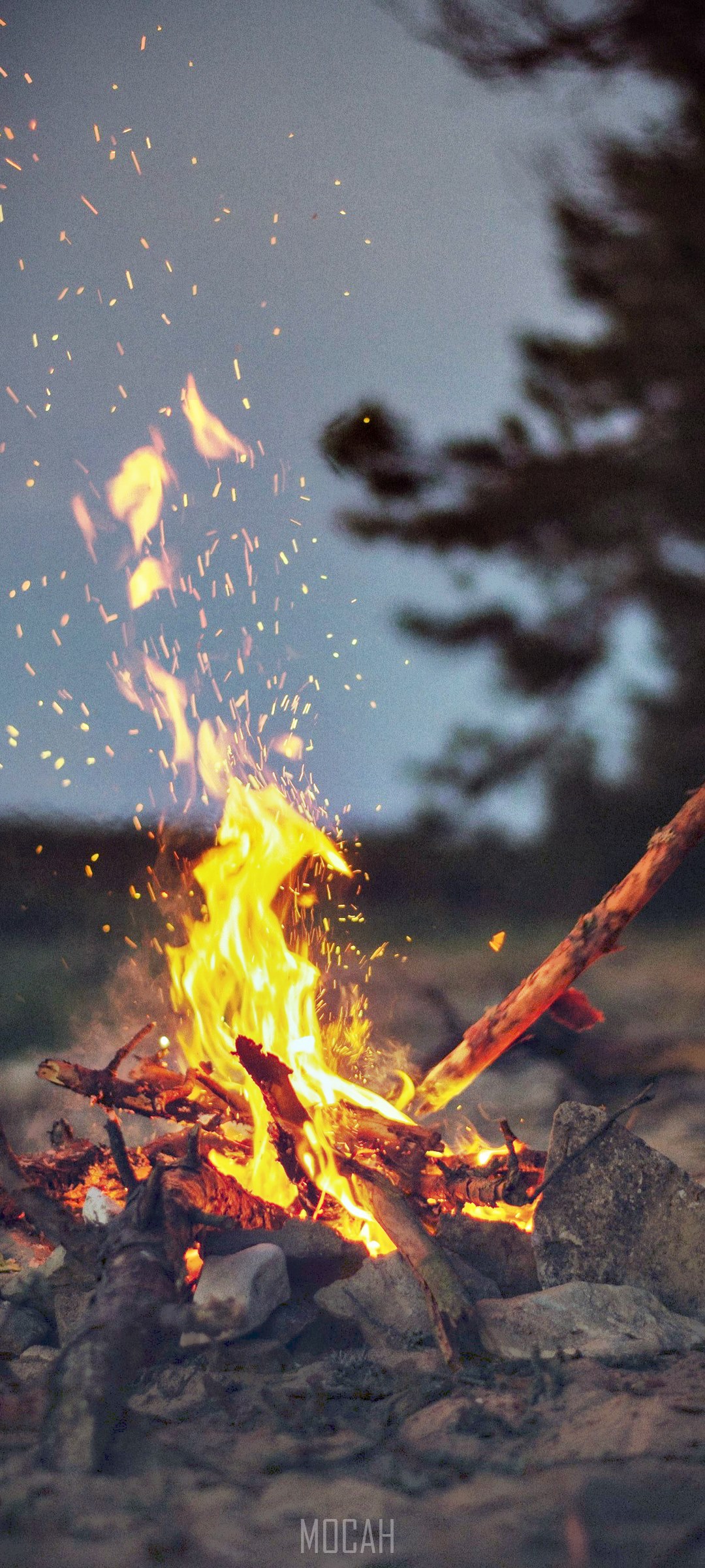 Campfire with sparks at dusk HD Phone Wallpaper