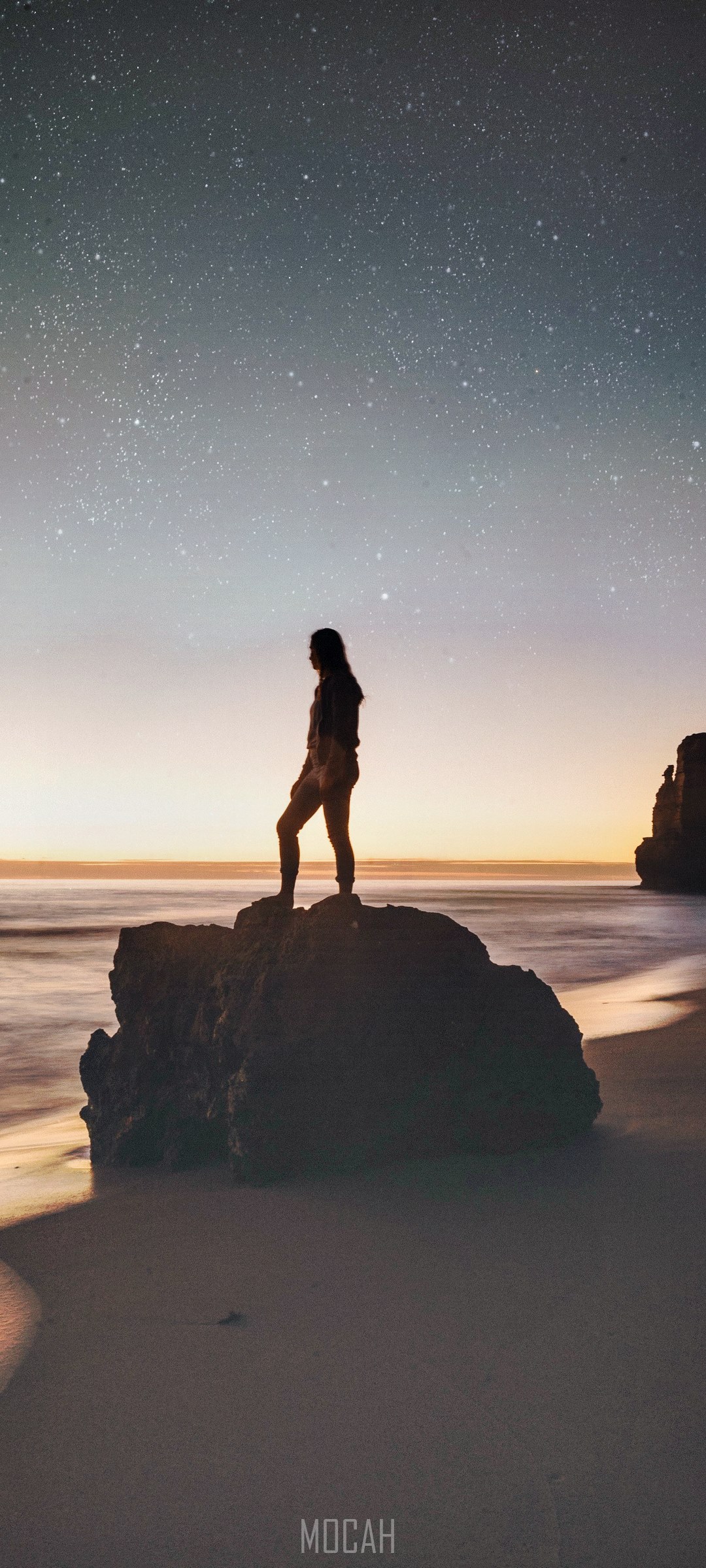 Woman standing on rock at Great Ocean Road under stars HD Phone Wallpaper