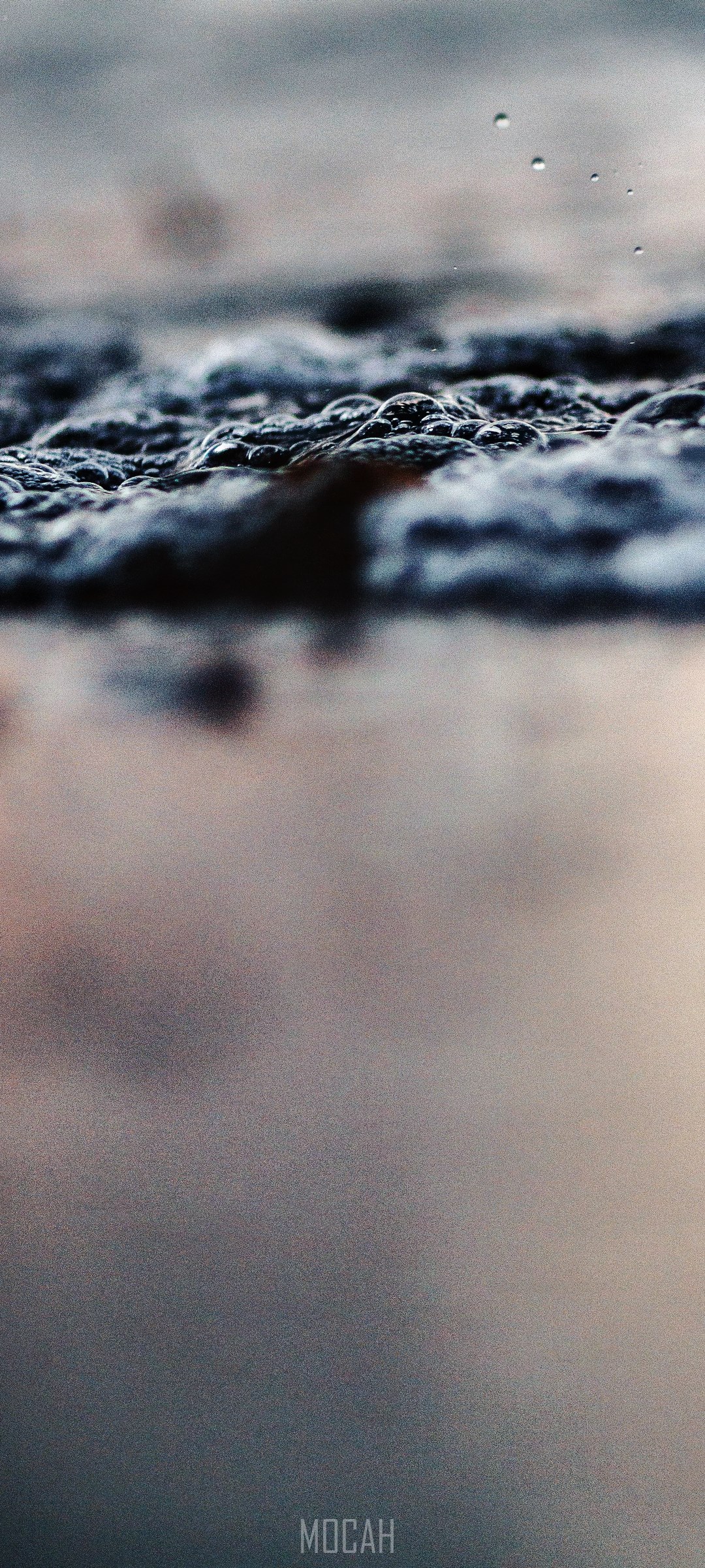Ocean bubbles on a dark surface with reflection HD Phone Wallpaper