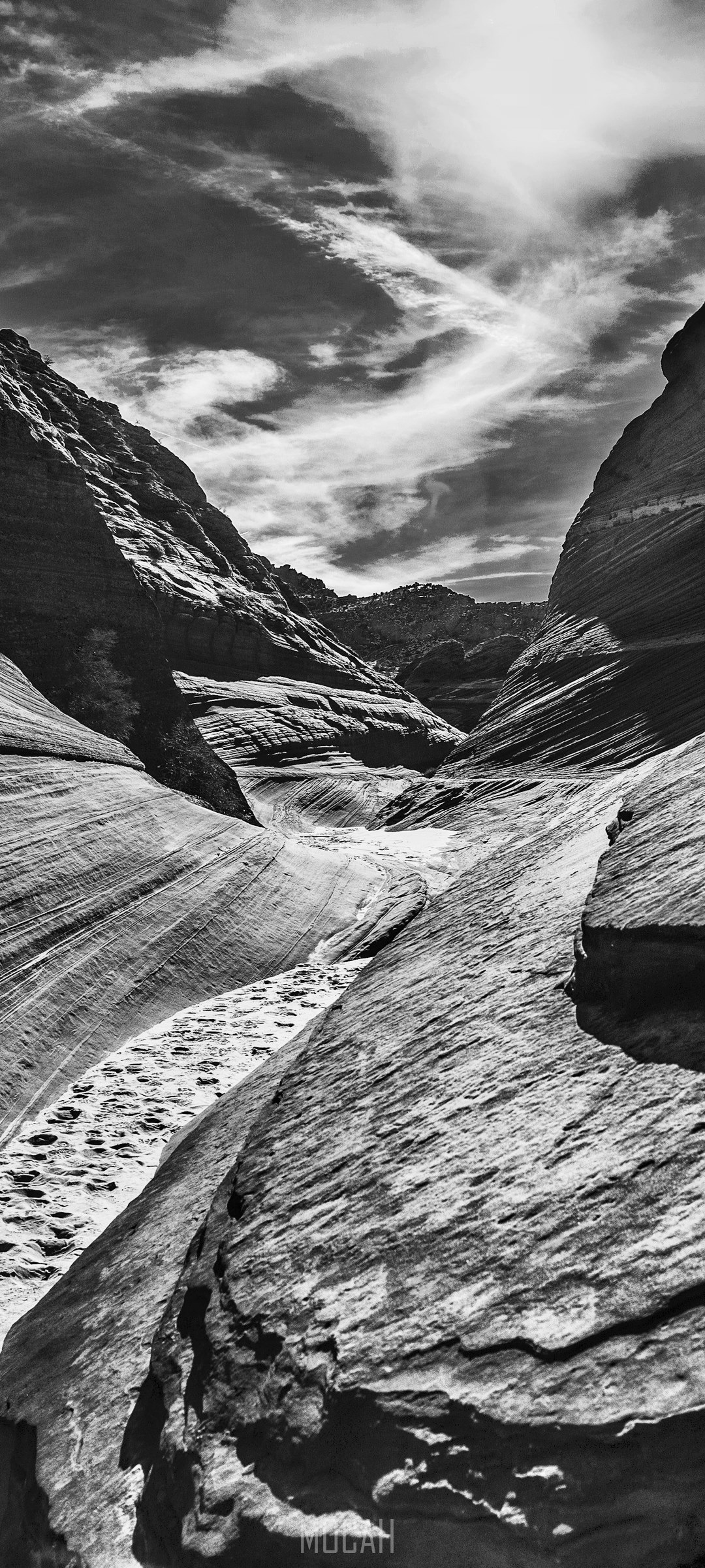 Black and white view of a sandstone canyon with dramatic clouds HD Phone Wallpaper