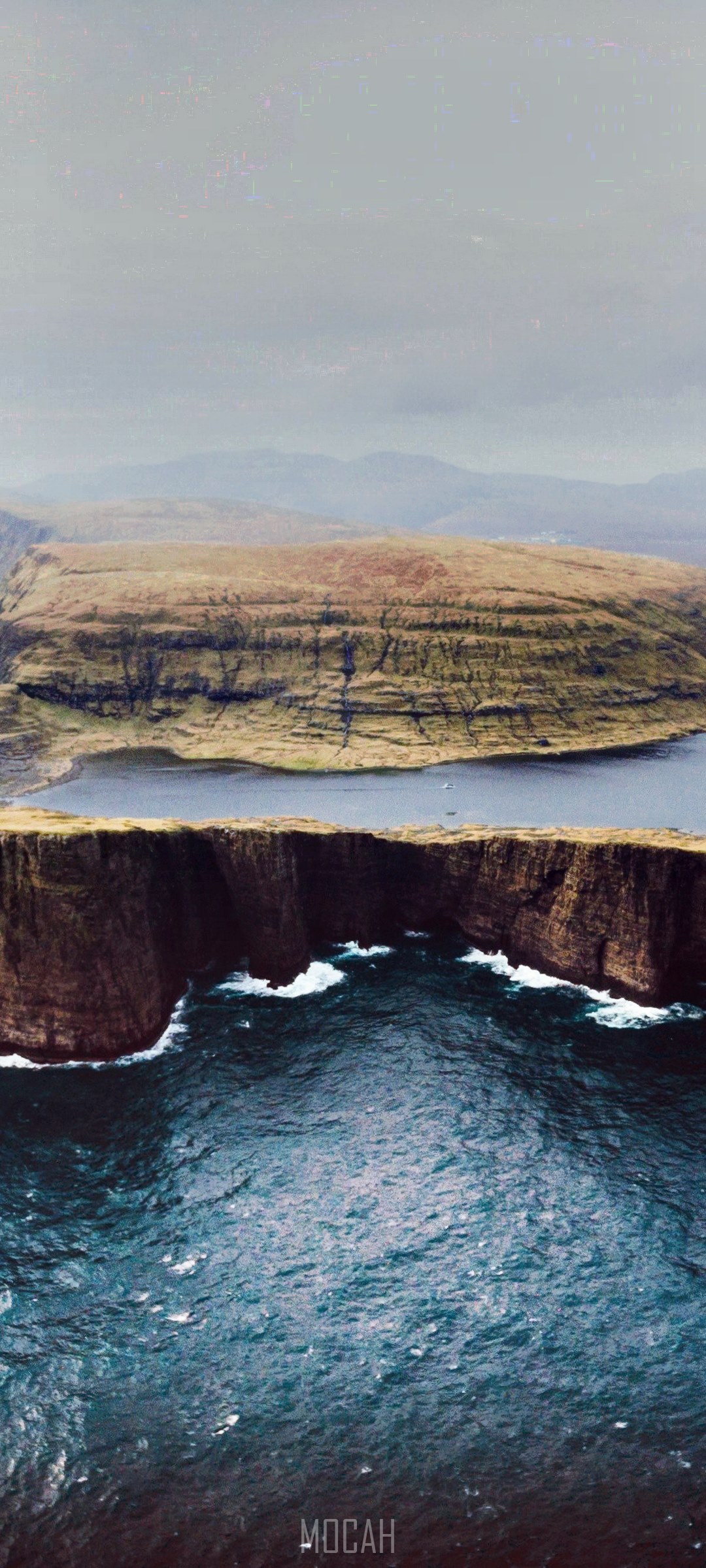 Faroe Islands lake and cliffs with ocean waves HD Phone Wallpaper