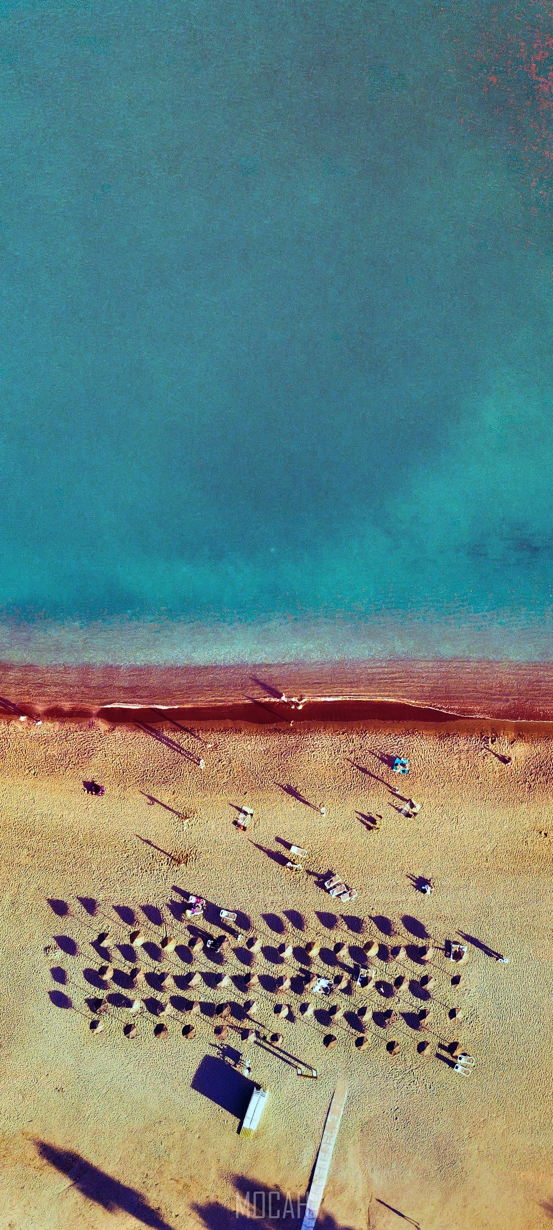 Aerial view of a beach with umbrellas and people HD Phone Wallpaper