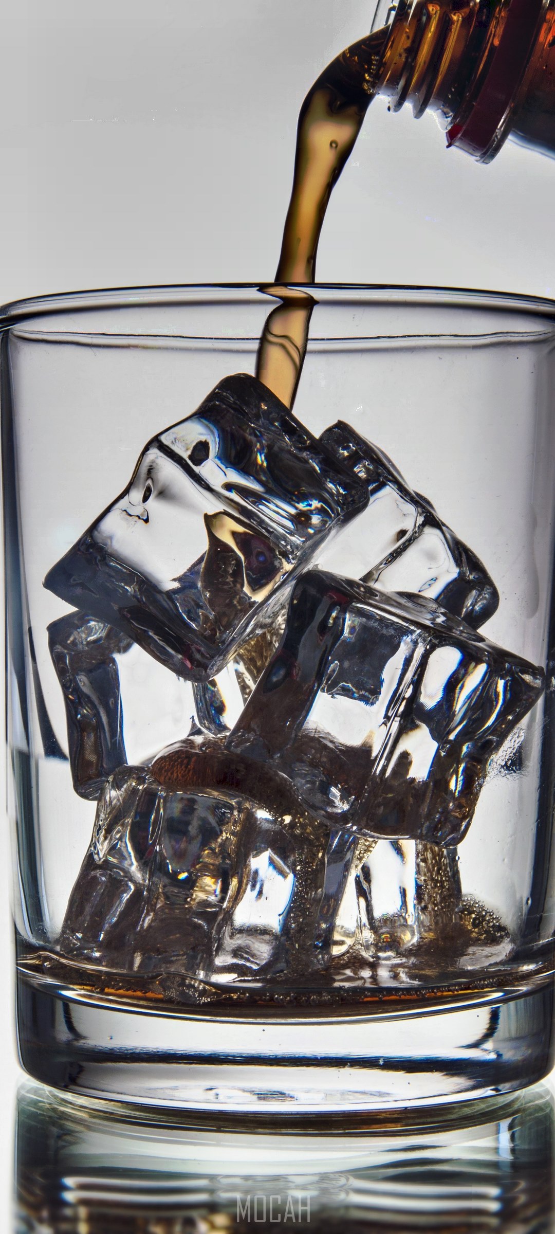 Cola pouring into a glass with ice HD Phone Wallpaper