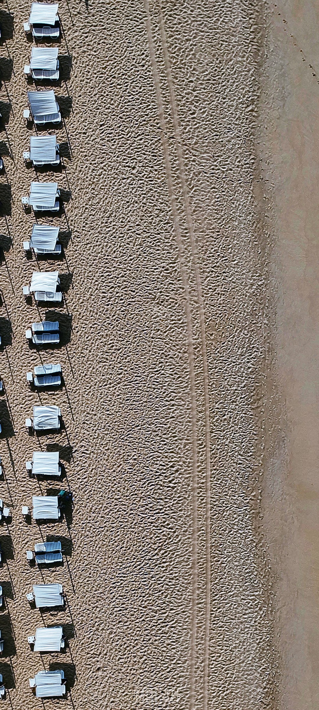Aerial view of beach chairs on sand HD Phone Wallpaper