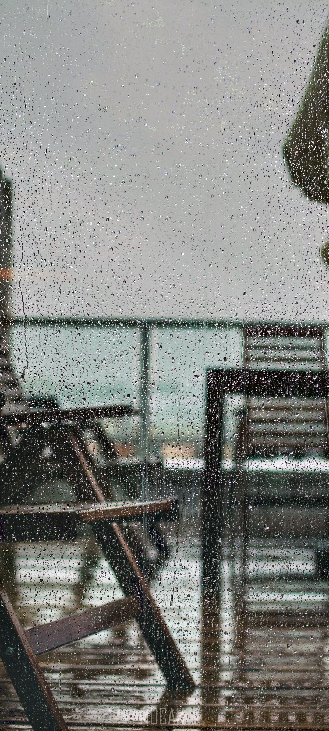 Balcony chairs on a rainy day HD Phone Wallpaper