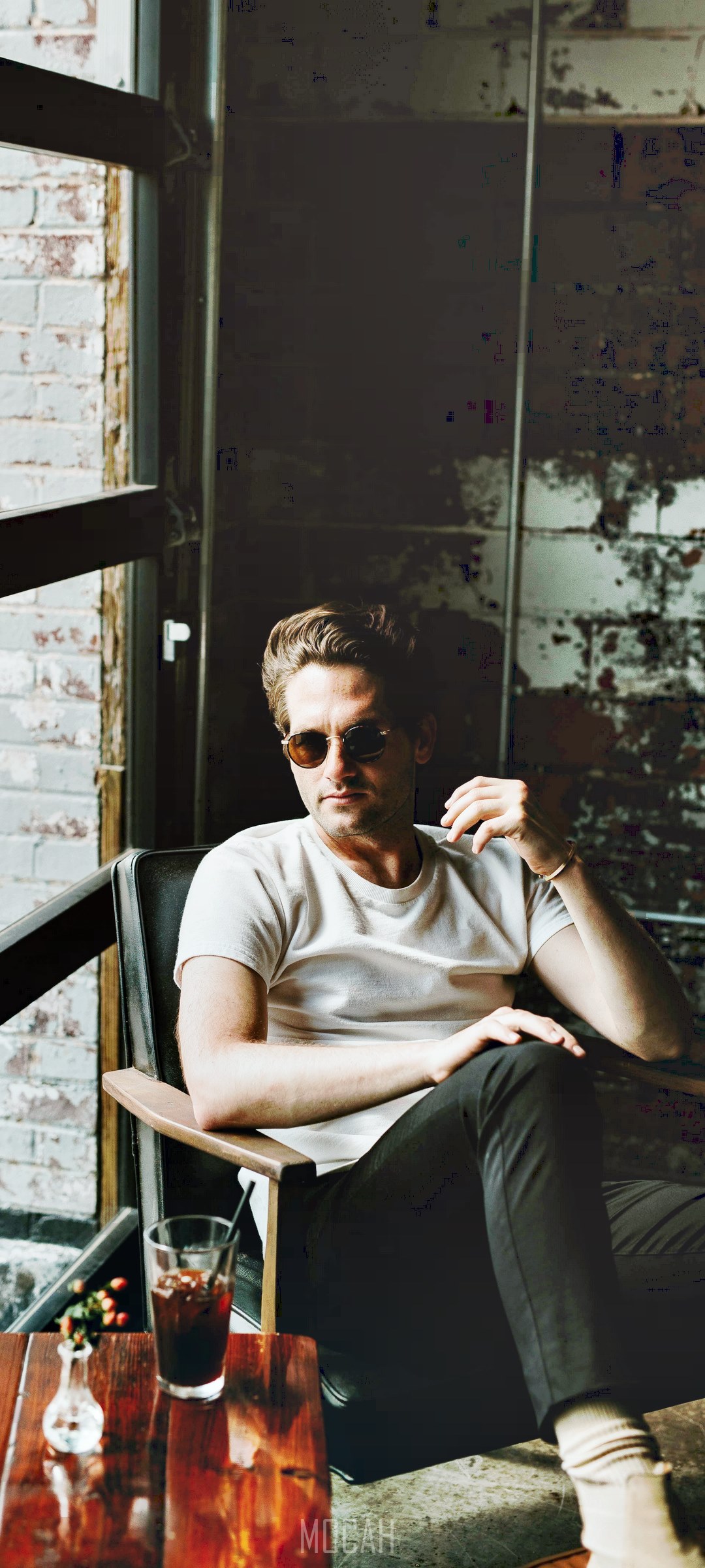 Man in sunglasses sitting in a coffee shop HD Phone Wallpaper