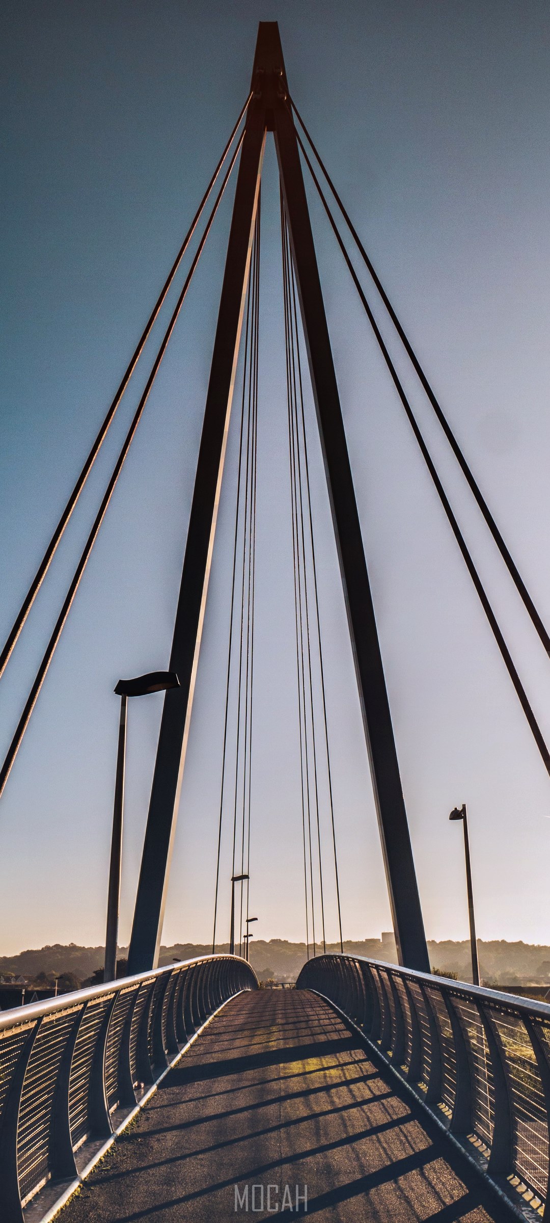Modern suspension bridge with cables and walkway HD Phone Wallpaper